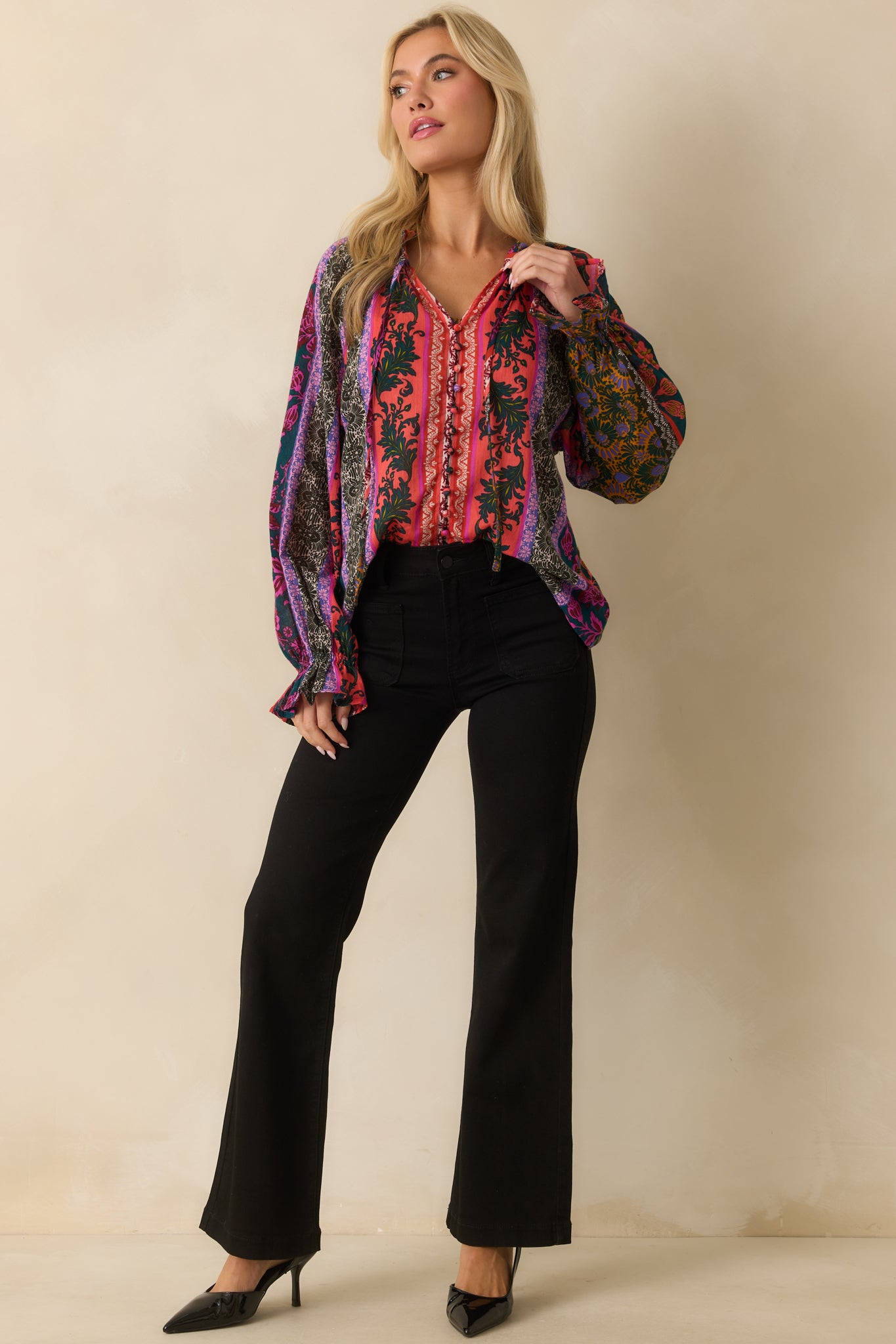 Black jeans featuring a high waist and relaxed flare fit.