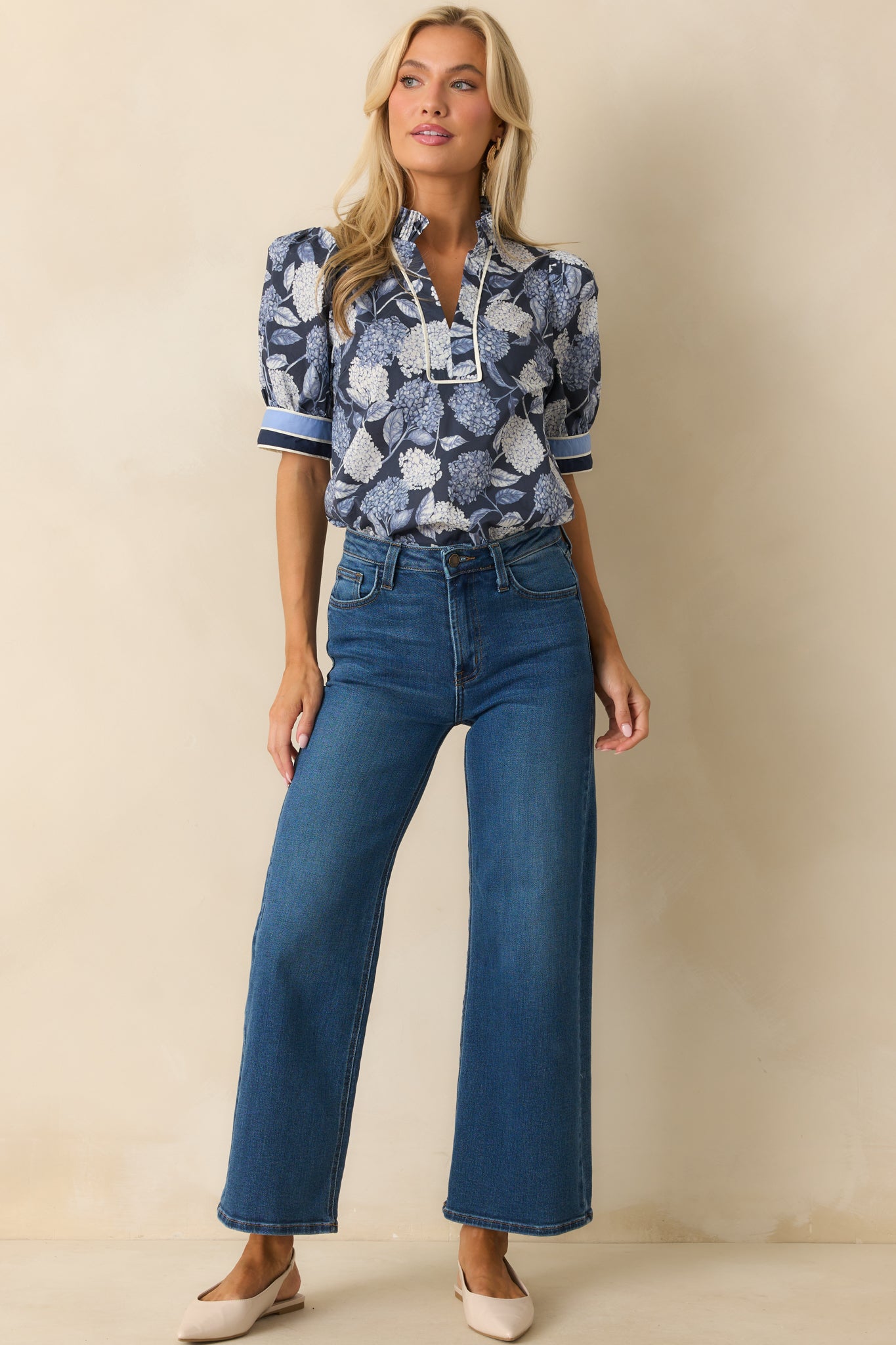 Blue hydrangea print top with a pleated ruffle collar and notch-v-neckline.