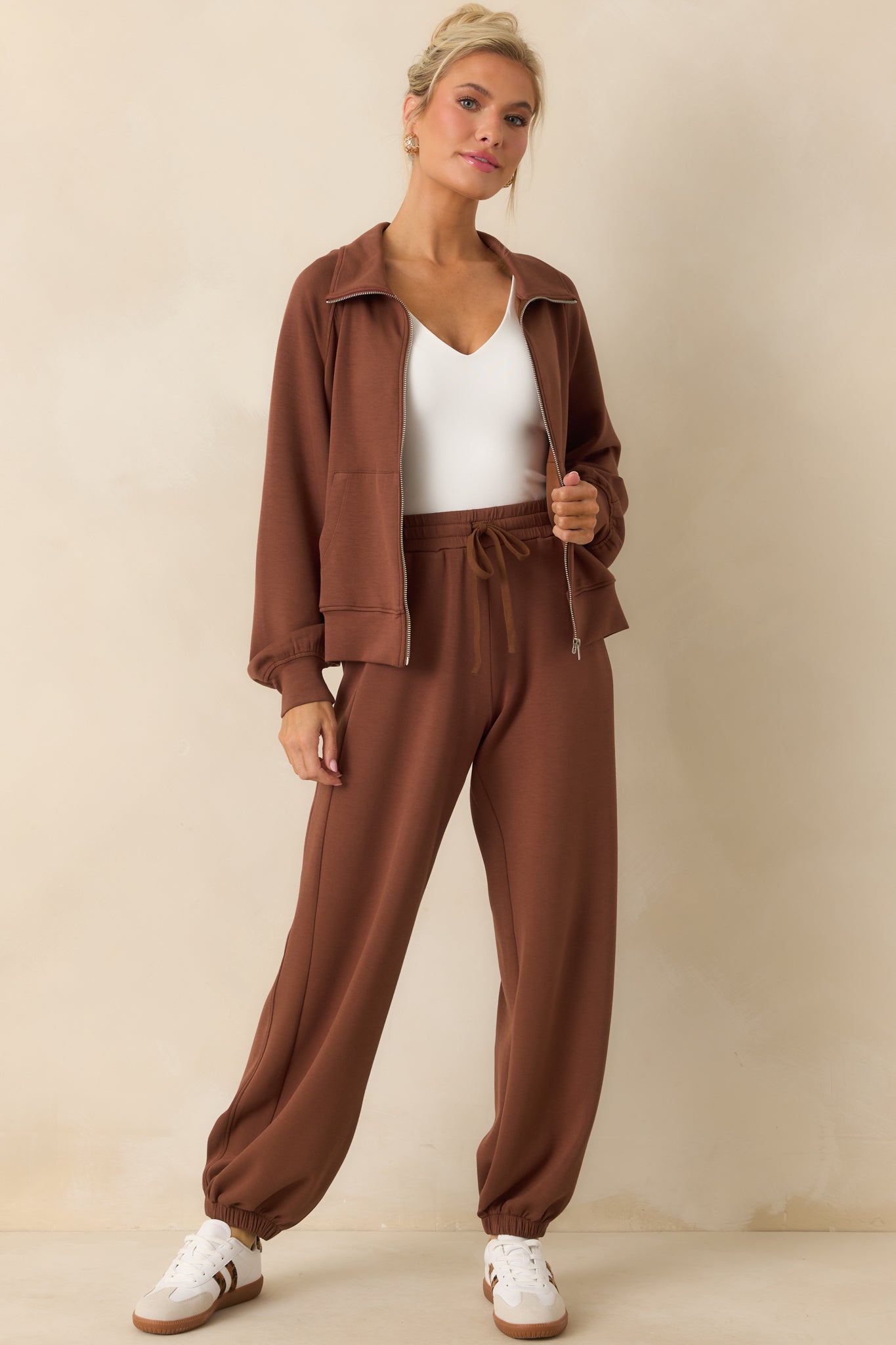 Front-facing shot highlighting the self-tie drawstring and relaxed fit of the joggers.