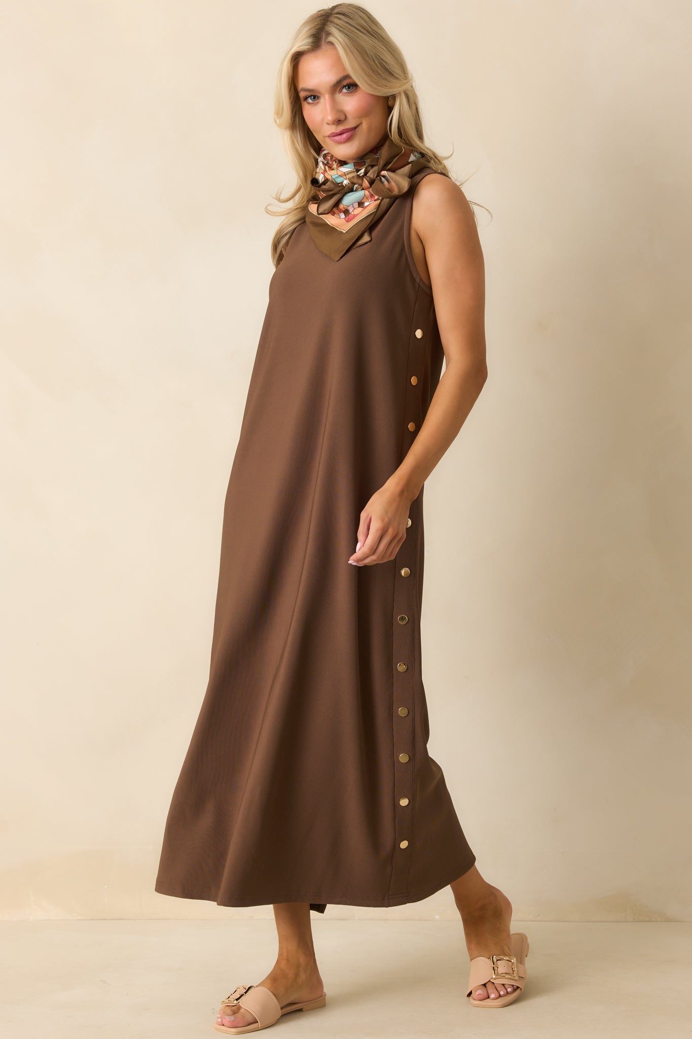 Full view of the brown maxi dress showing the relaxed fit and sleeveless silhouette.