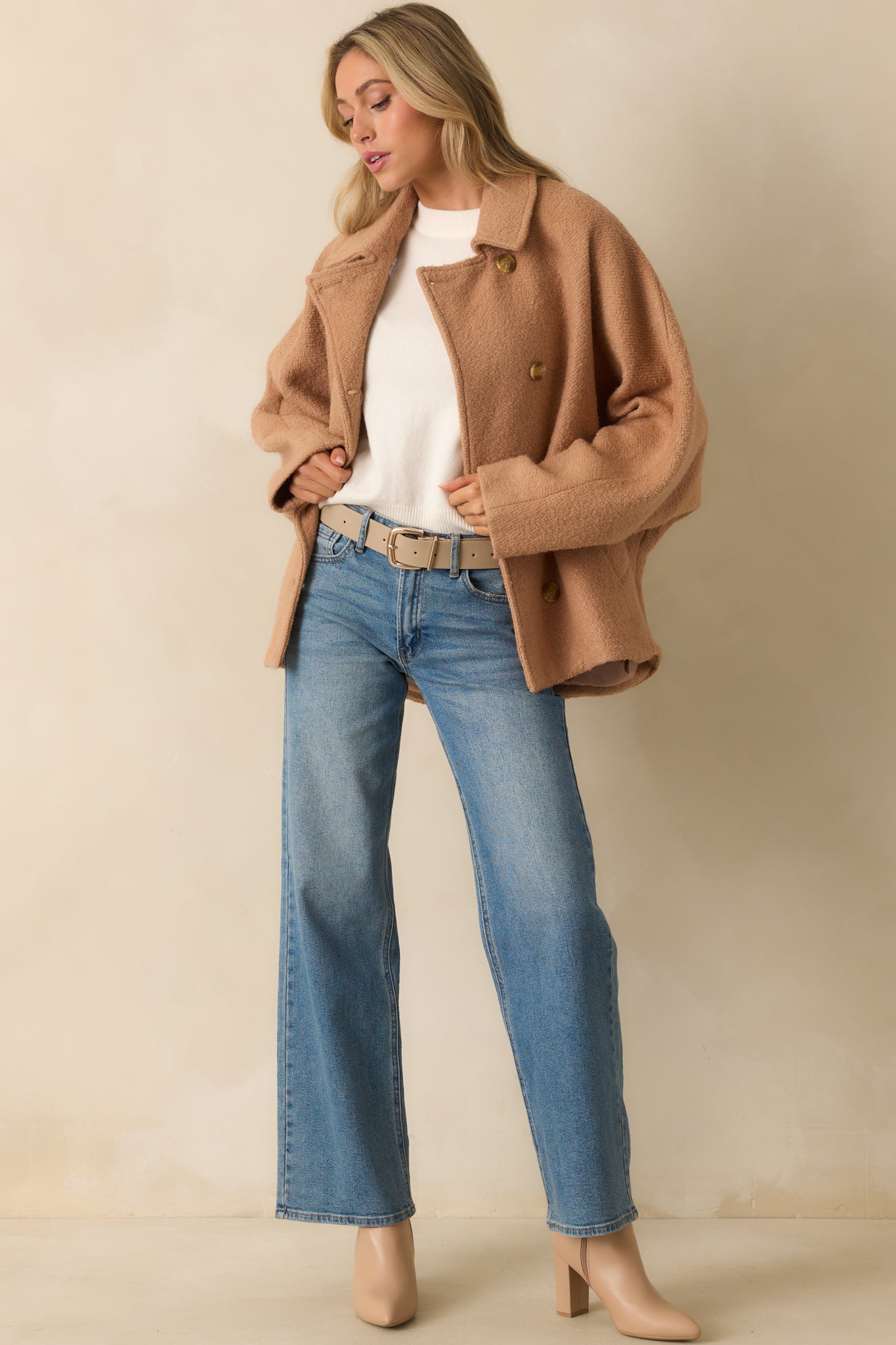 Camel brown wool-blend coat with a collared neckline and single-breasted button front closure.