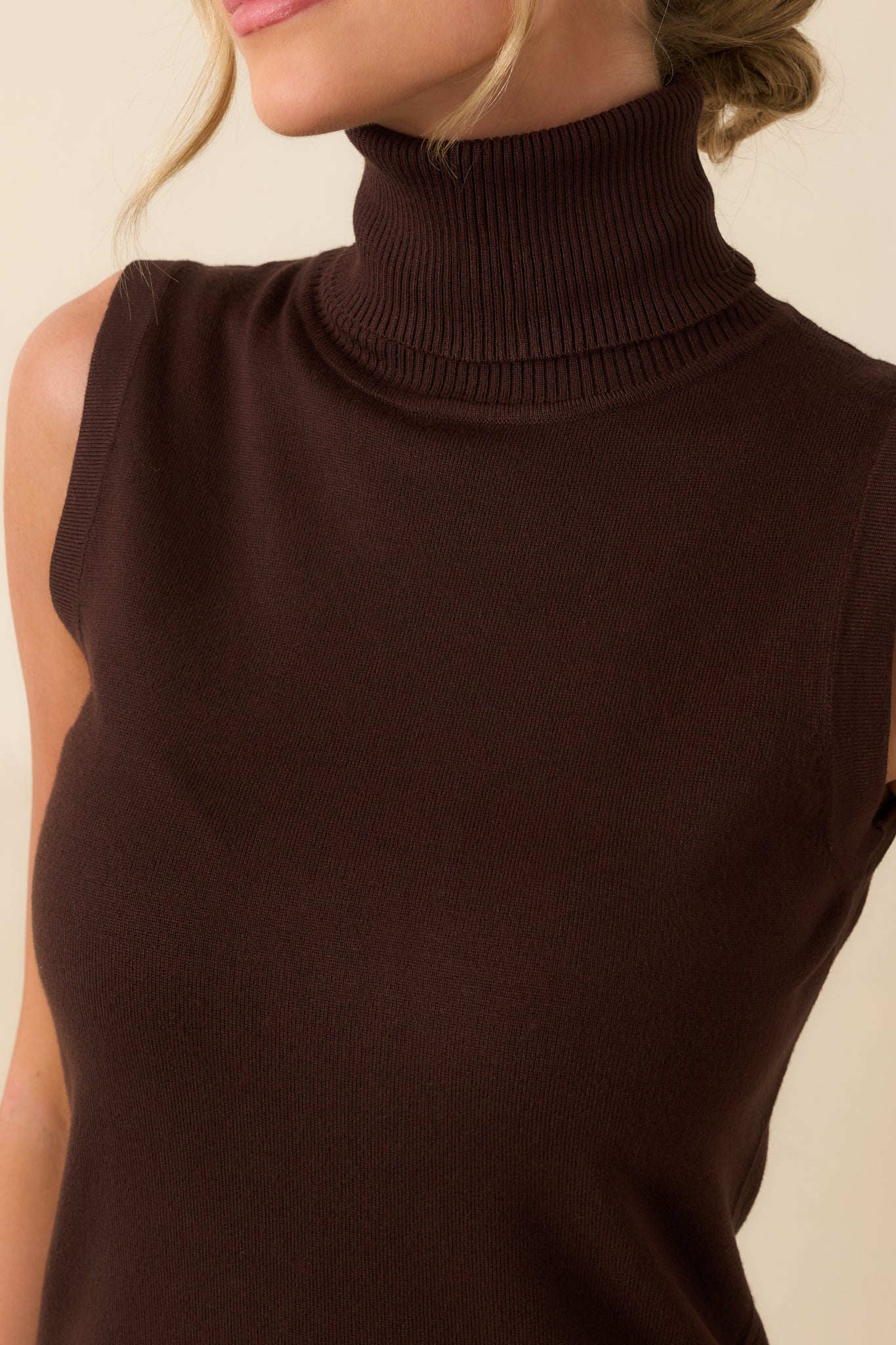 Zoomed-in view showing the soft knit fabric and tightly spaced ribbed texture near the neckline.