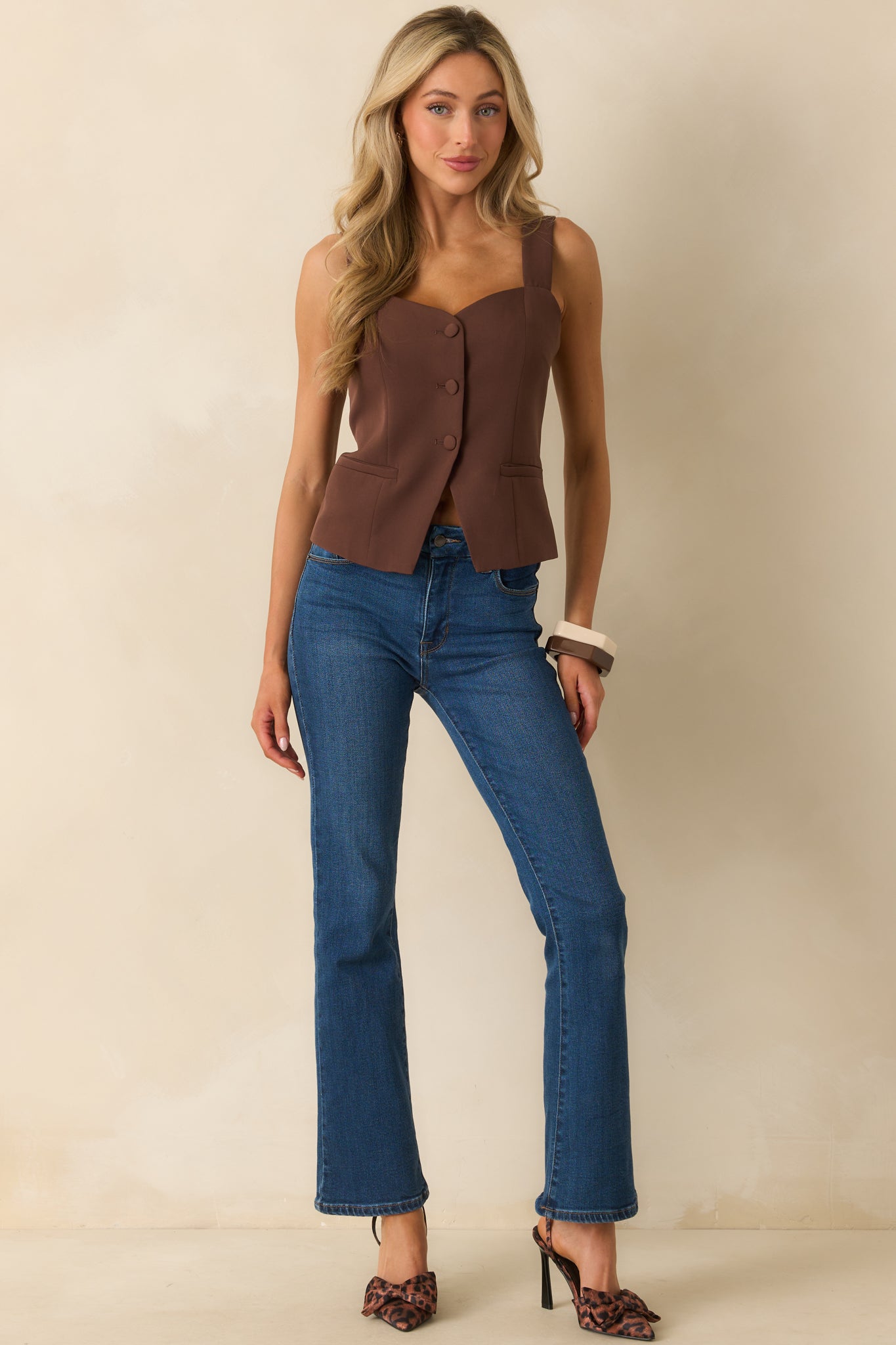 Full length shot of the top styled with a sleek, fitted design.