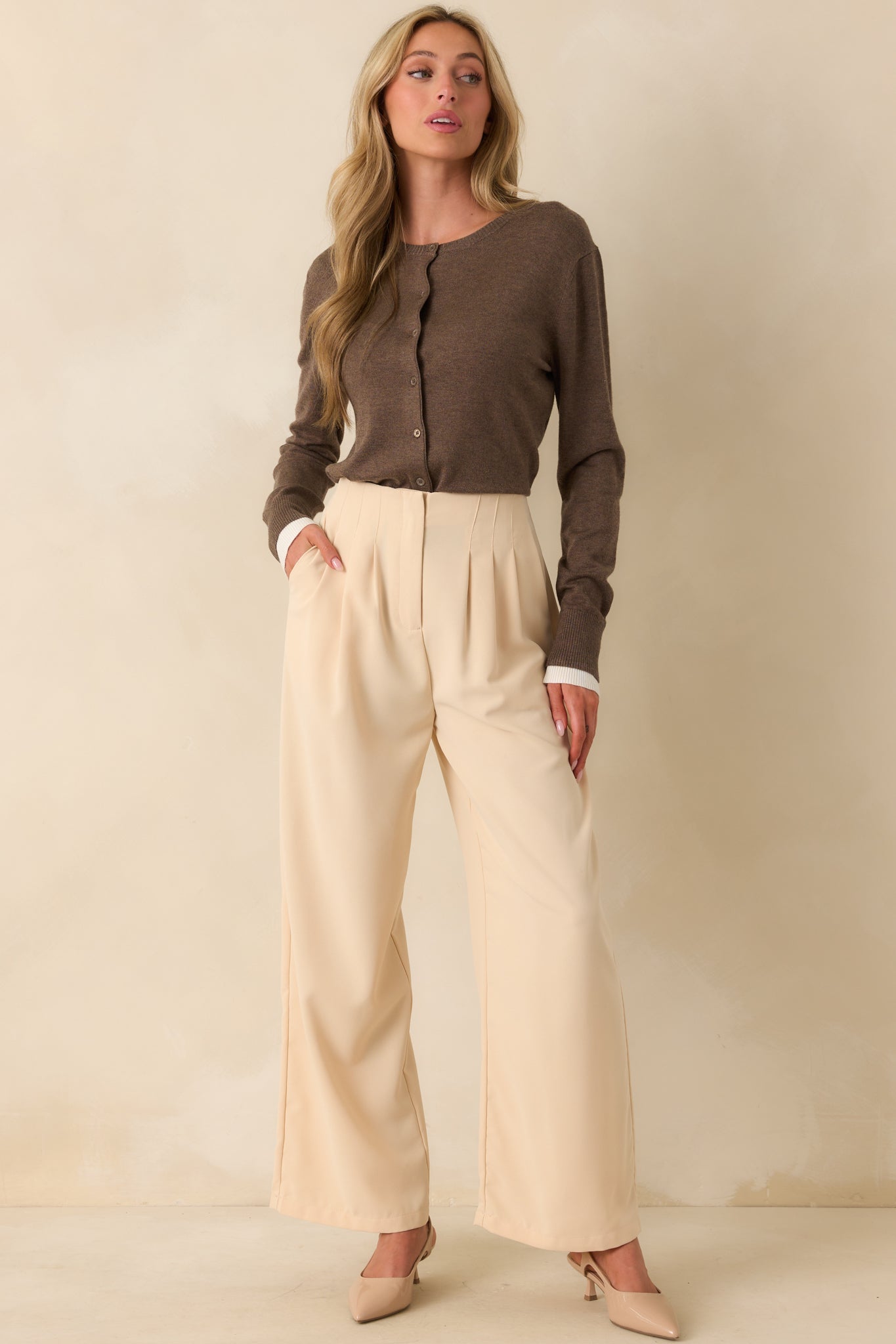 Full body shot highlighting the lightweight wool blend fabric and relaxed silhouette of the cardigan.