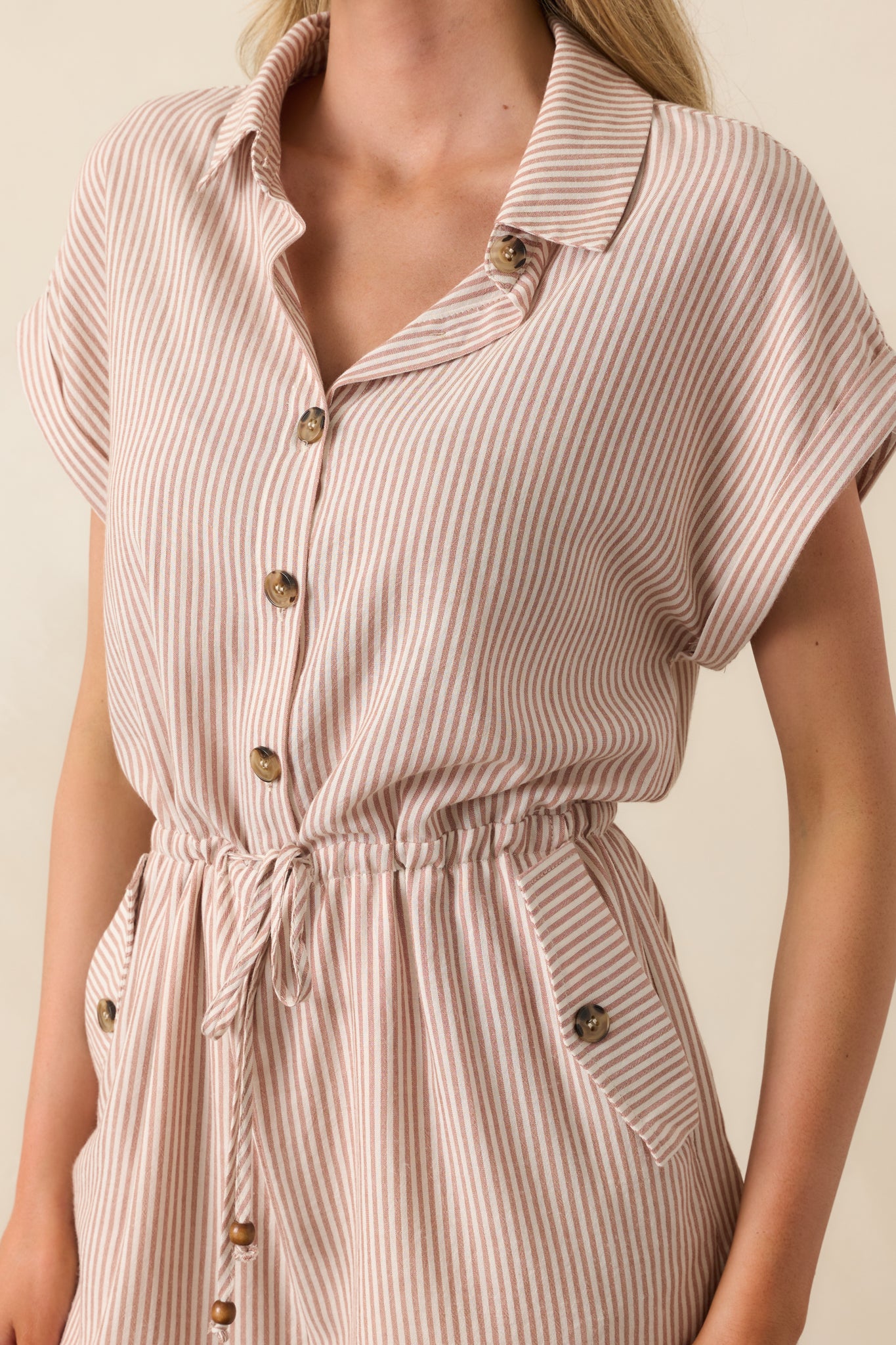 Tight shot of the button placket and collar, highlighting stitching details and the smooth texture of the fabric.