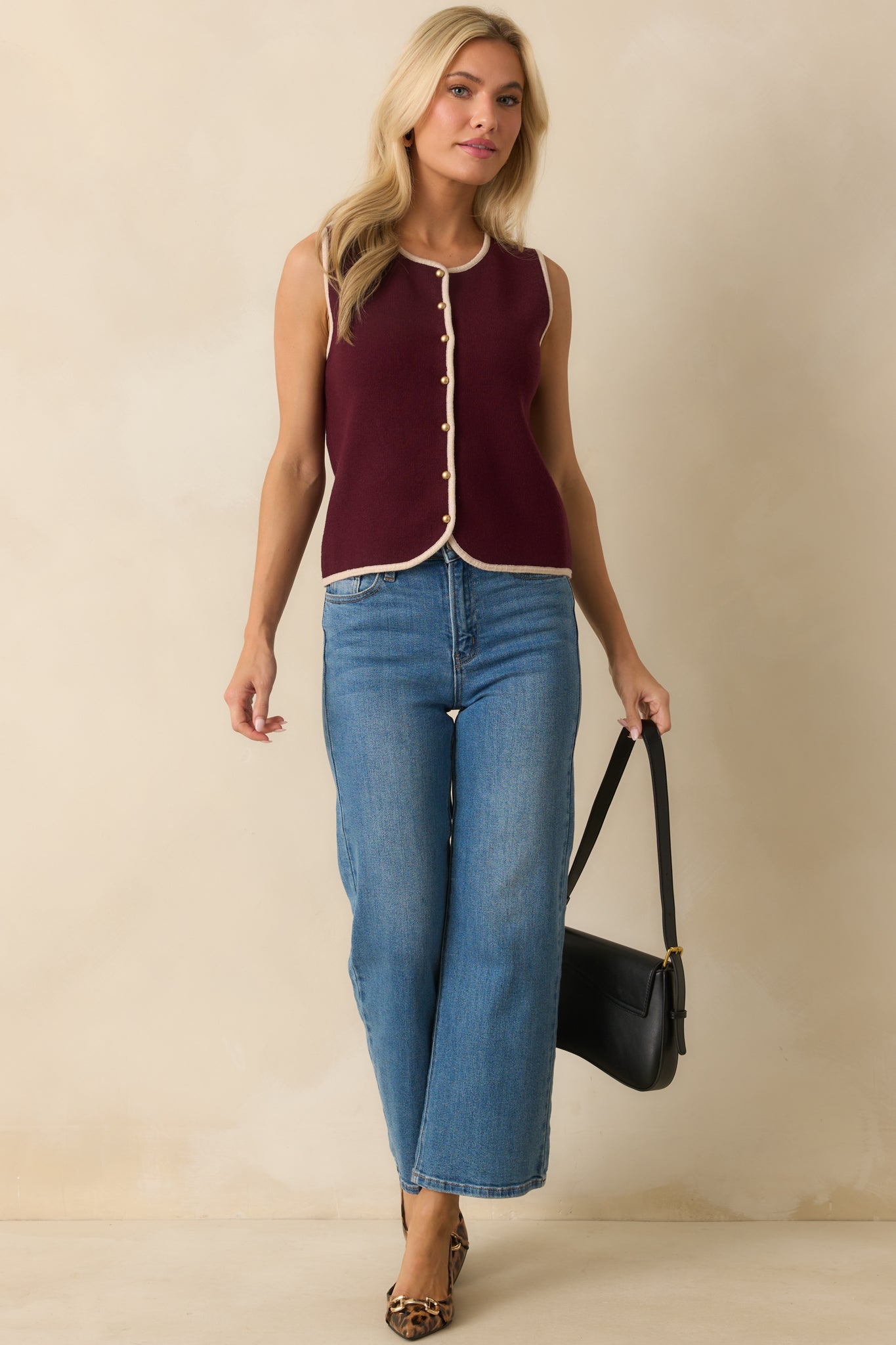 Crew neck sweater vest in burgundy with contrasting ivory edges for a polished look.