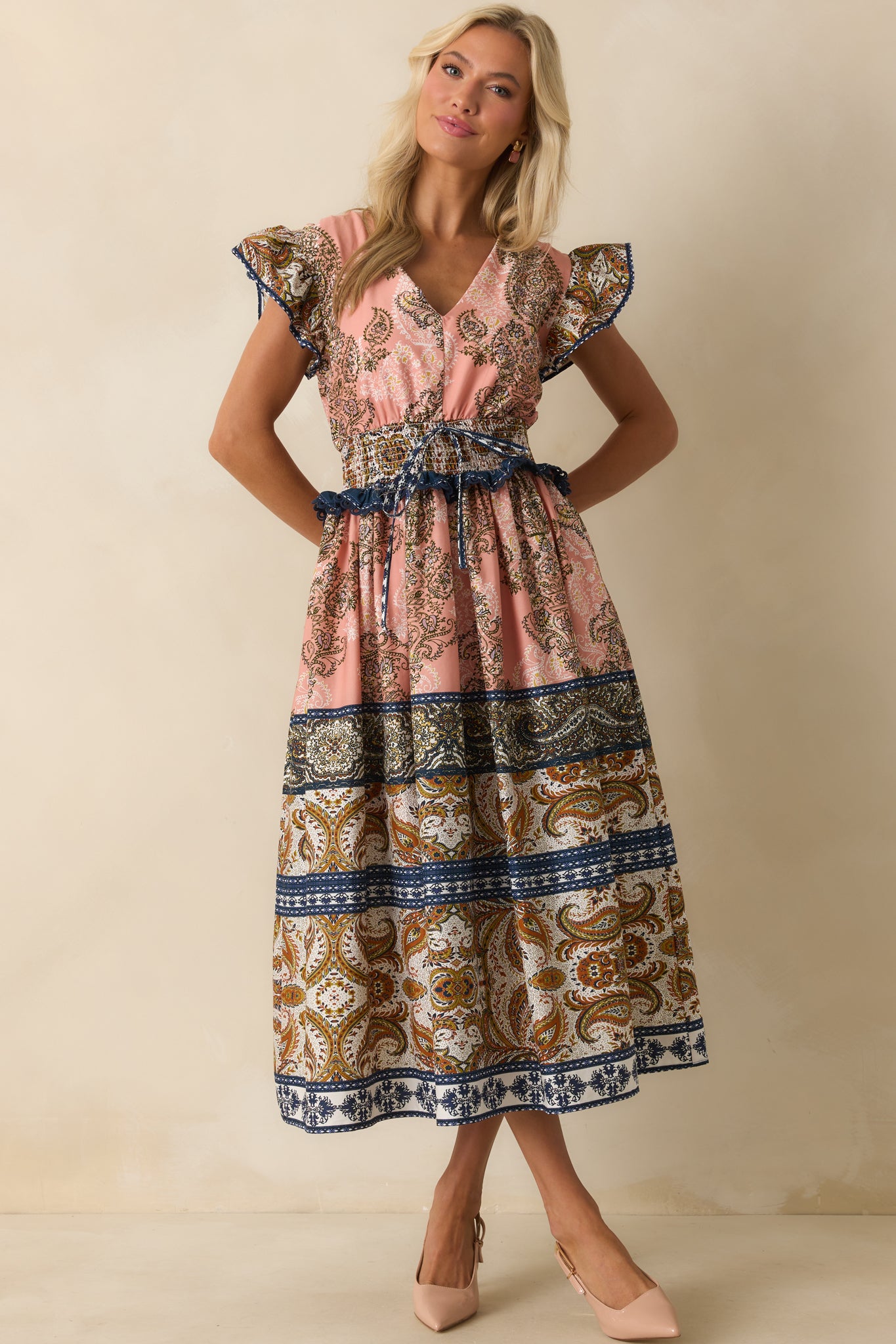 Elegant rose pink dress combining a smocked waist and gathered skirt for a flattering shape