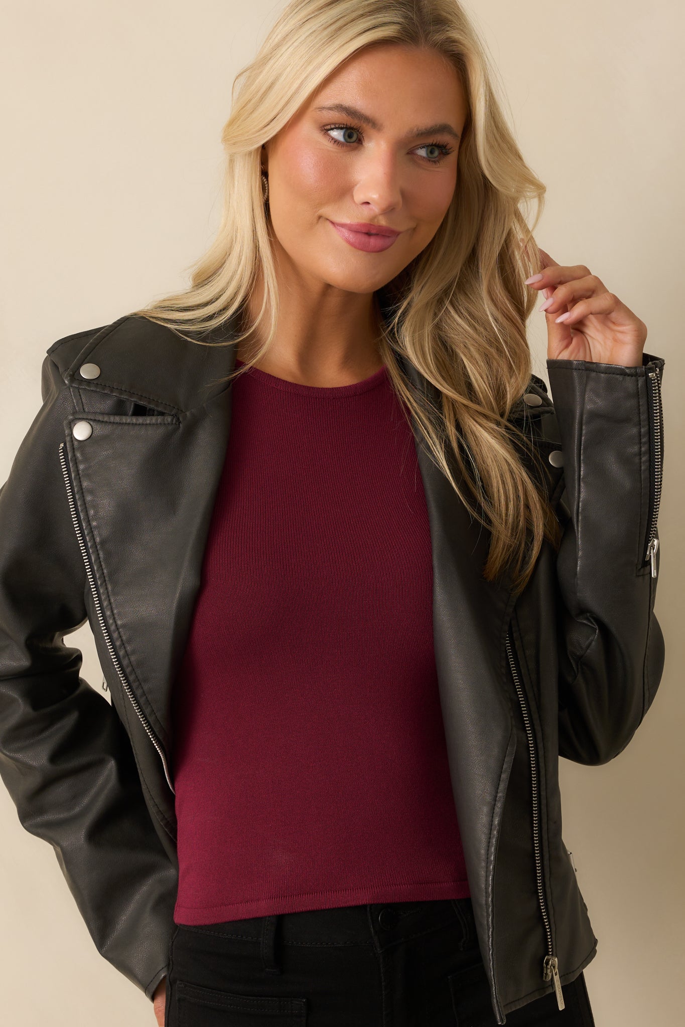 Shoulder and sleeve detail shown on the long sleeve faux leather jacket.