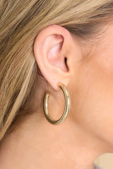 These gold hoop earrings feature a textured gold finish, and a secure post-back fastening.