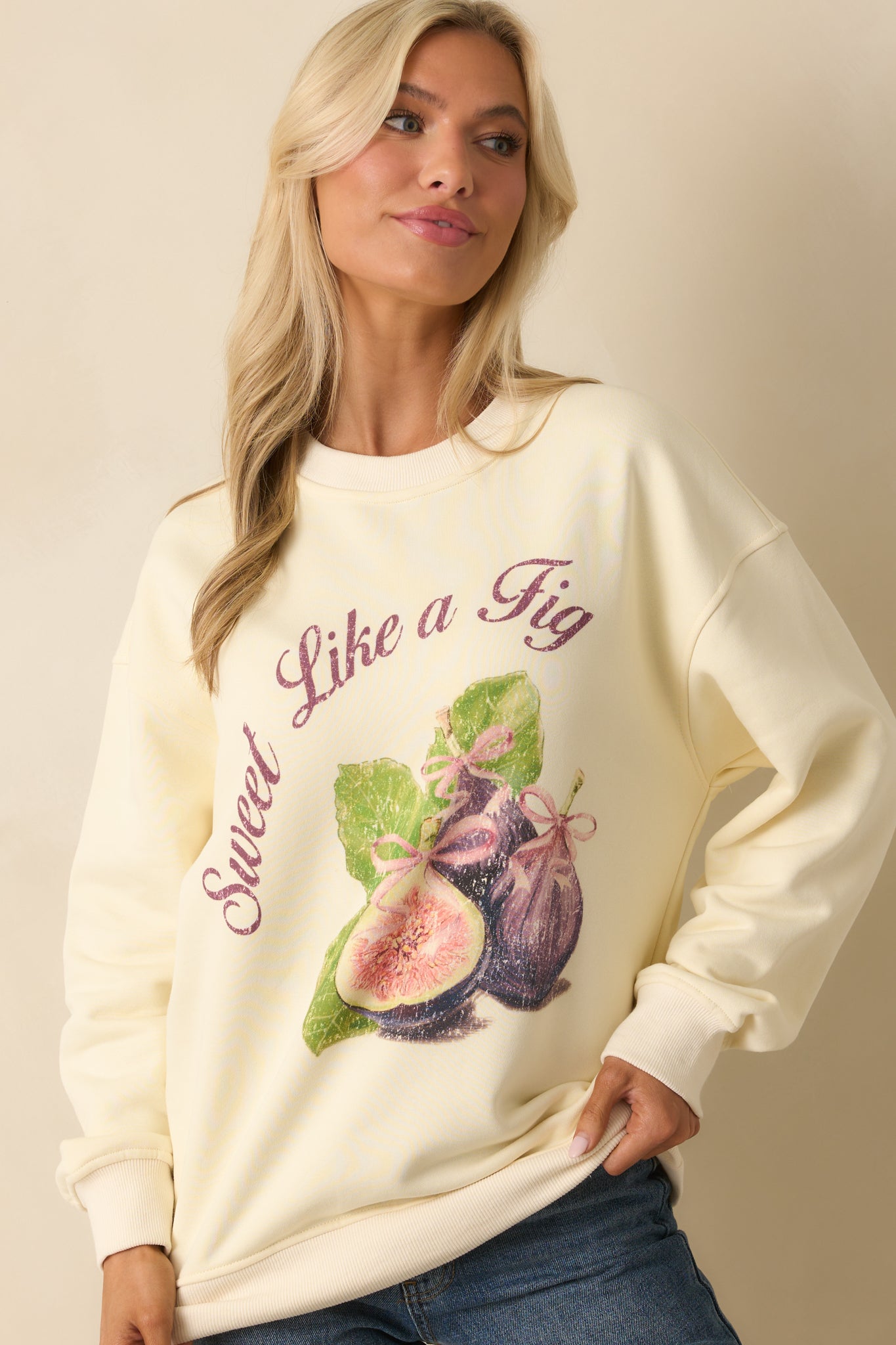 Focused cropped shot of sweatshirt graphic showcasing fig artwork across the chest.