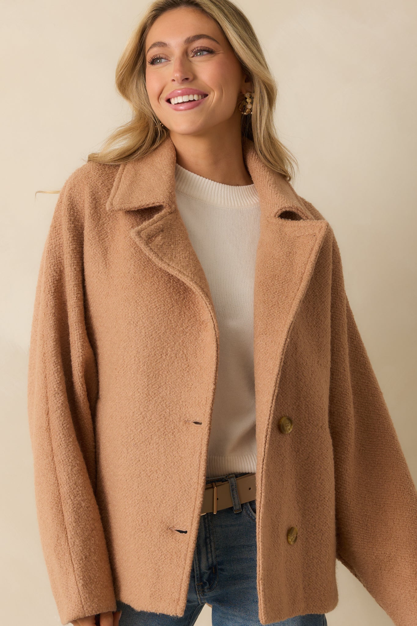 Front button fastening shown on the single-breasted coat design.