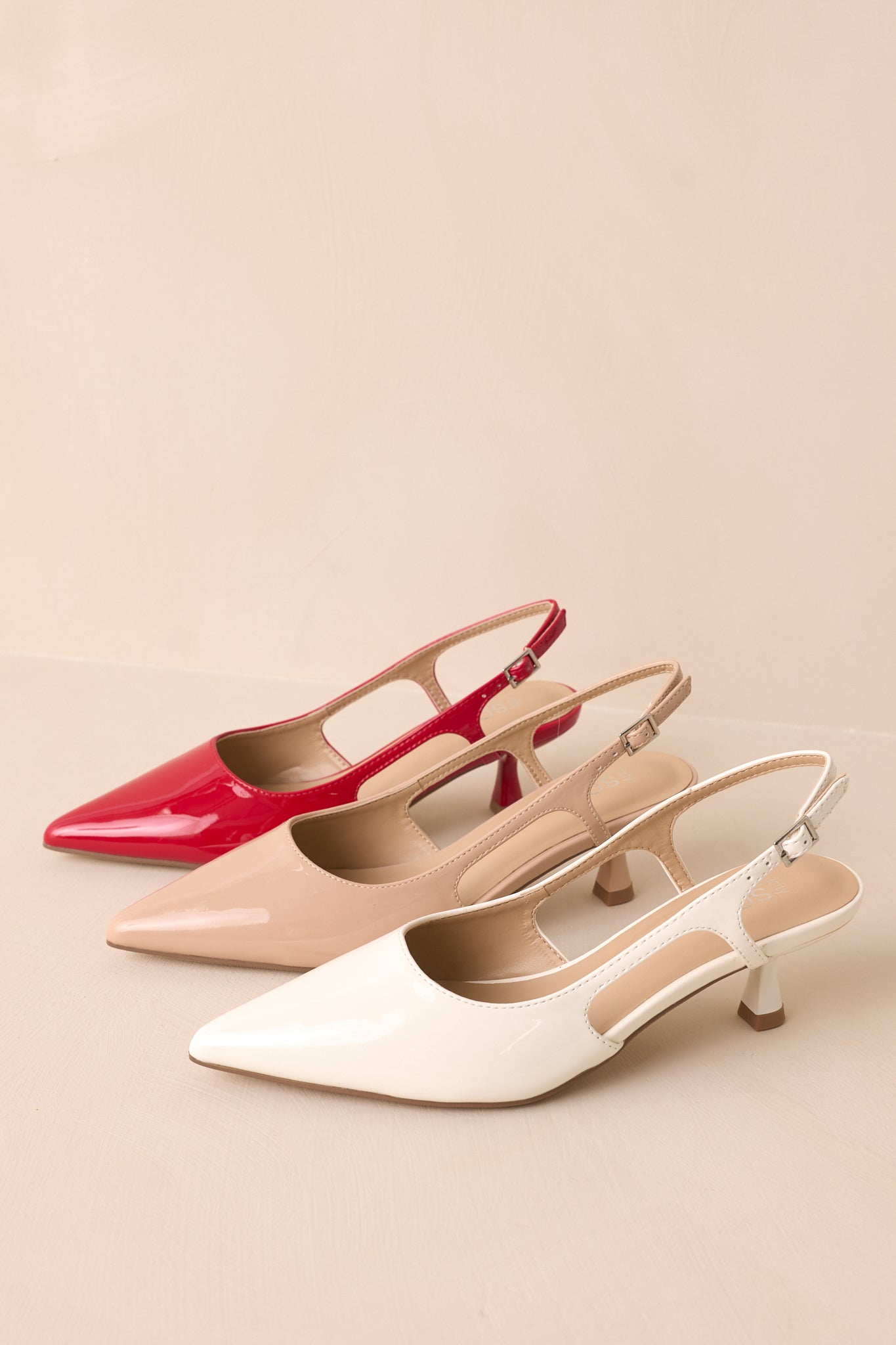 White pointed-toe heel with two other color options.