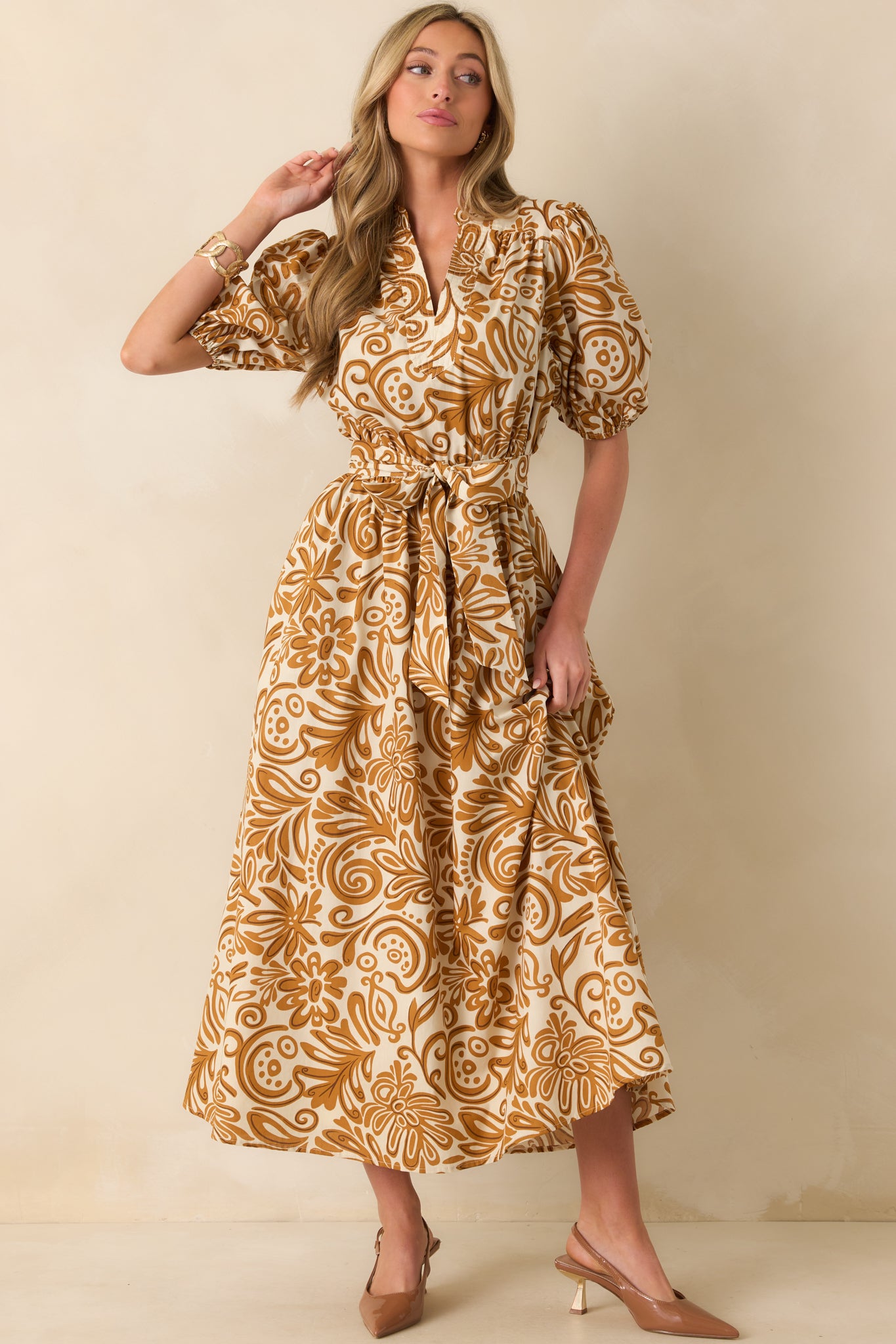 Golden yellow print maxi dress with notch v-neckline, short puff sleeves, and a relaxed silhouette.