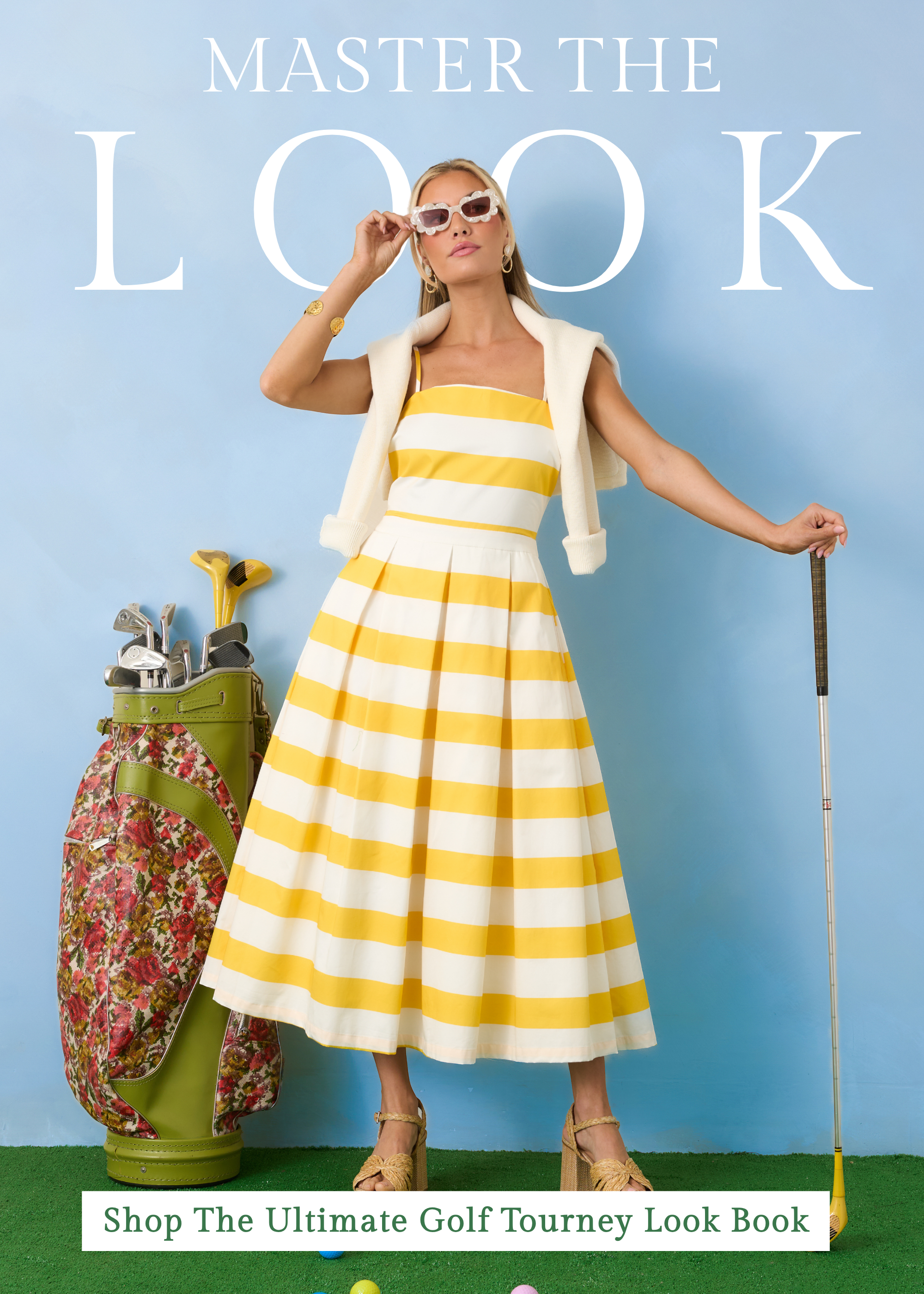 Model wearing a yellow and white striped midi dress with platform heels and sunglasses styled with golf clubs and a floral golf bag against a blue backdrop for our Master The Look campaign. This image links to shop the Ultimate Golf Tourney Look Book featuring stylish outfits perfect for golf tournaments and spring events.