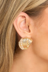 These earrings feature an intertwined design with small faux pearl detailing and secure post backings. 