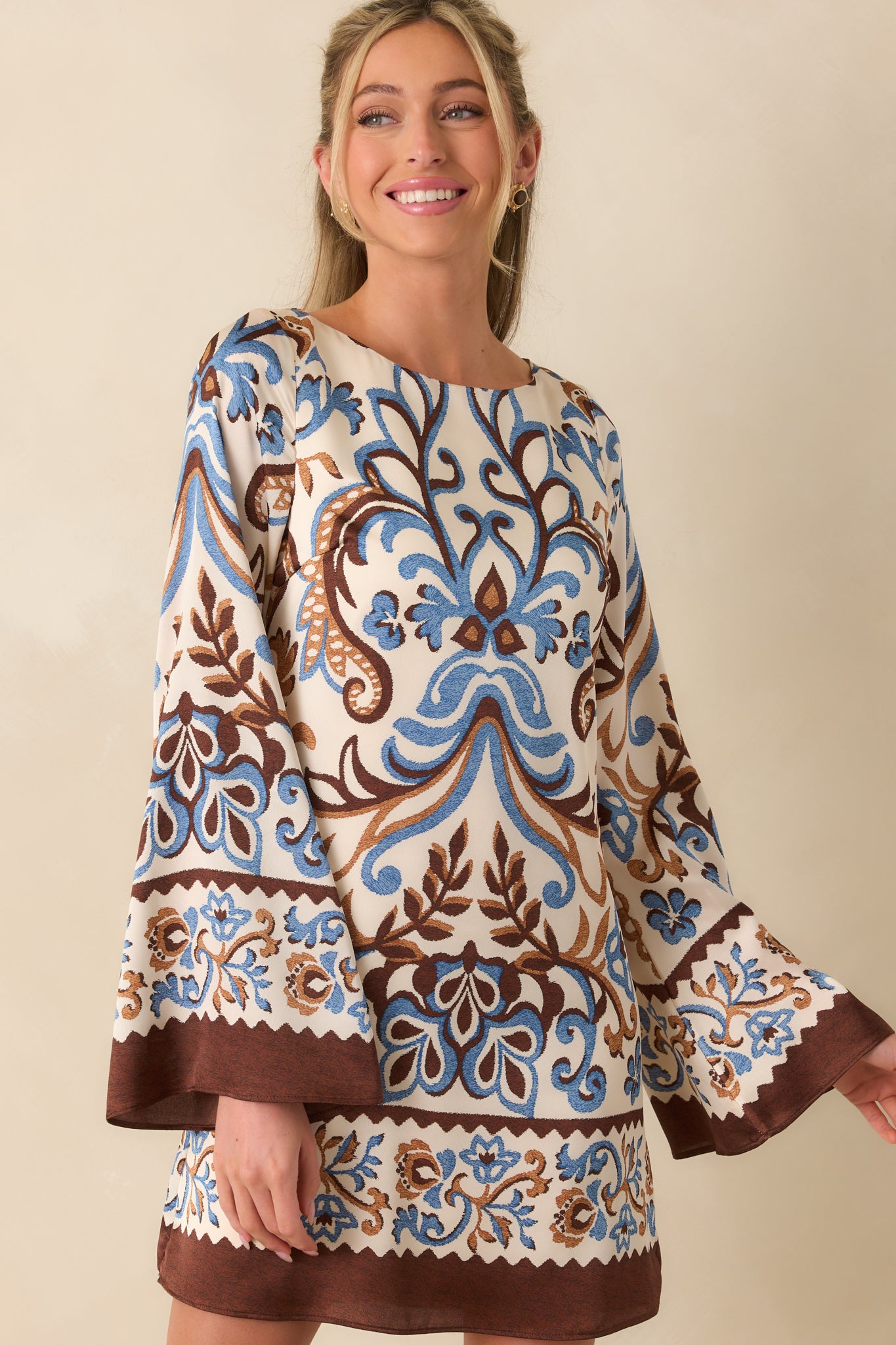 Cropped view capturing the intricate mix of blue and brown floral paisley print.
