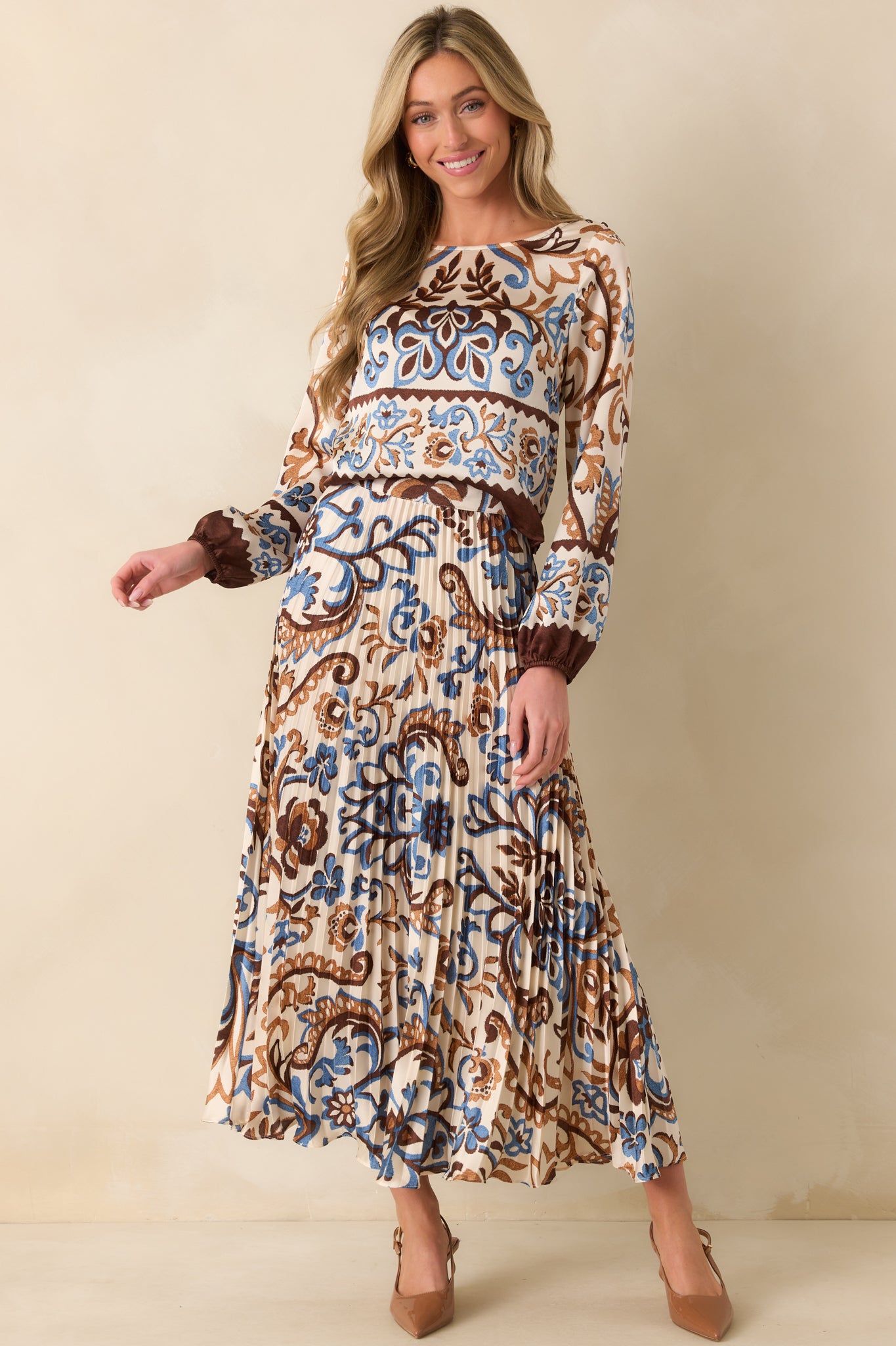 Full length photo emphasizing the tailored cropped fit and shiny satin finish.