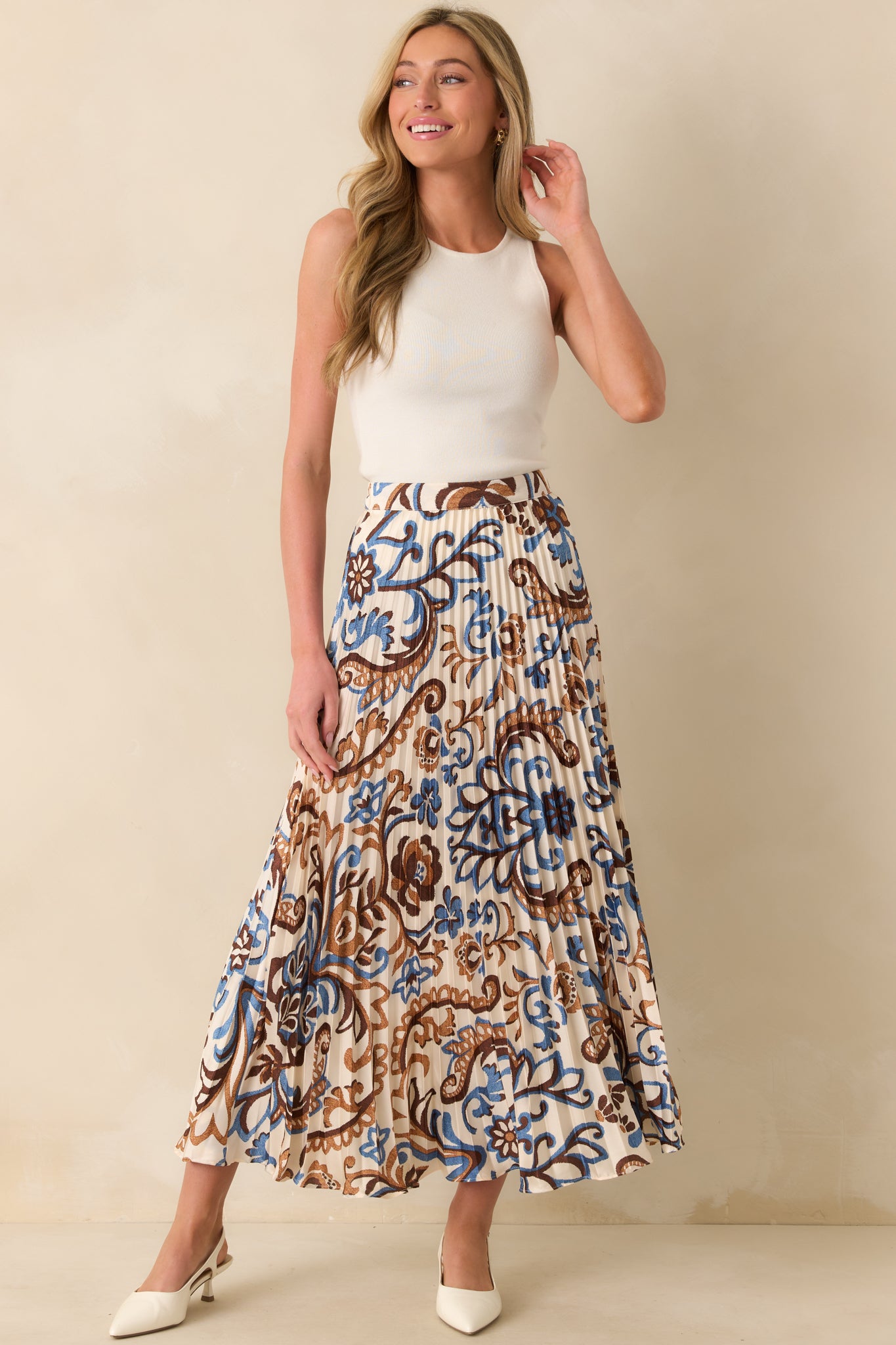 Full view of the ivory maxi skirt with blue and brown paisley floral print
