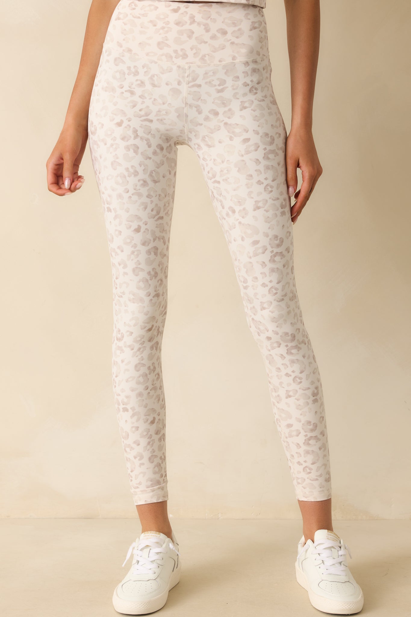 Leopard print leggings highlighting the smooth stretch fabric and fitted shape.