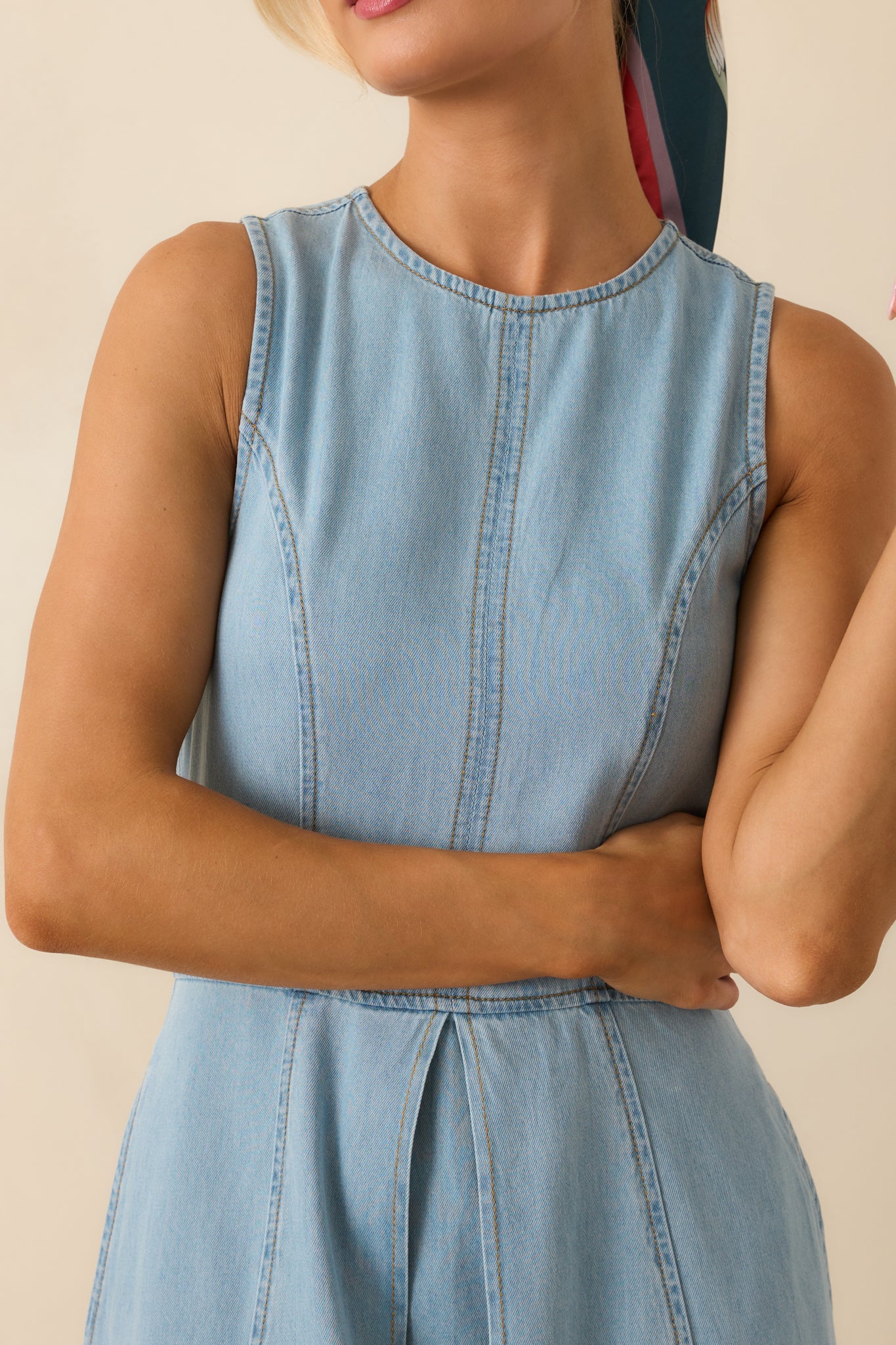 Fabric and front pleat detail of light wash chambray midi dress with panelled design.