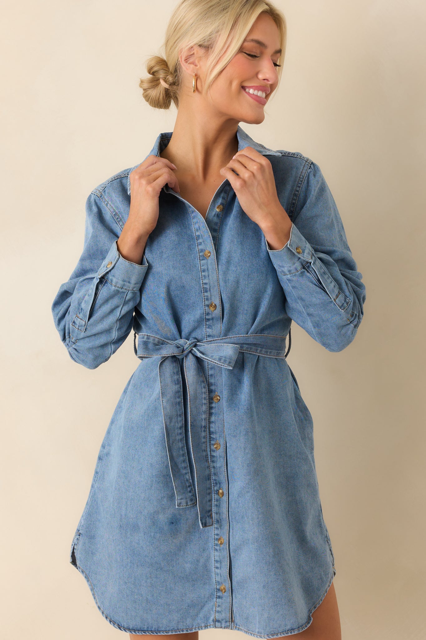 Cropped view focusing on the collared neckline and functional button front.