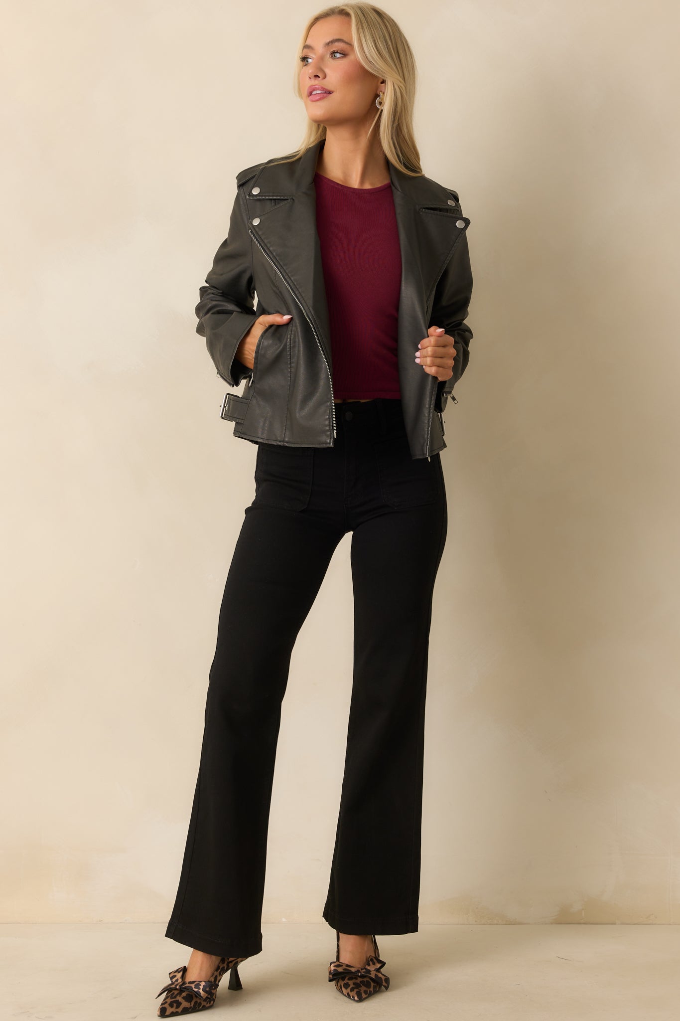 Long sleeve jacket featuring a structured silhouette and functional zippered pockets.