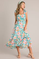 Full body view of this Floral square-neck dress with elastic sleeves, smocked back, elastic waistband, and flowy skirt
