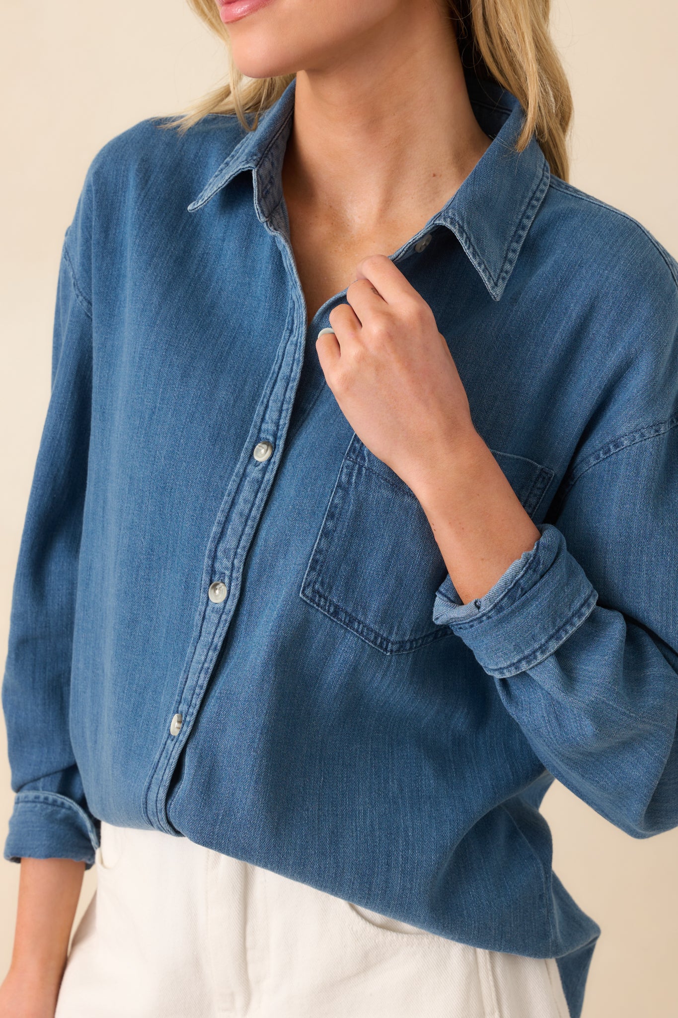 Close-up of the button front and fabric texture, showing the fine weave and tonal stitching of the cotton blend material.