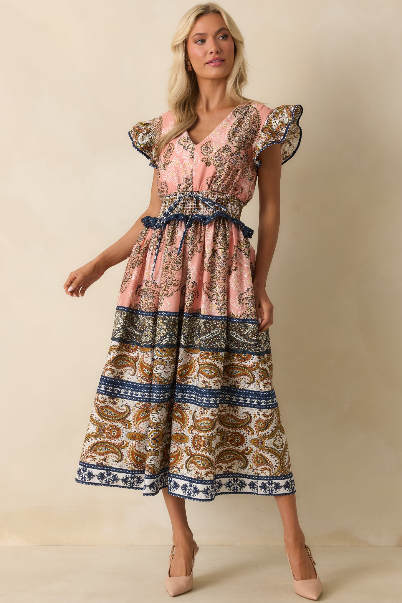 Midi dress styled with functional side pockets and a full, breezy silhouette.