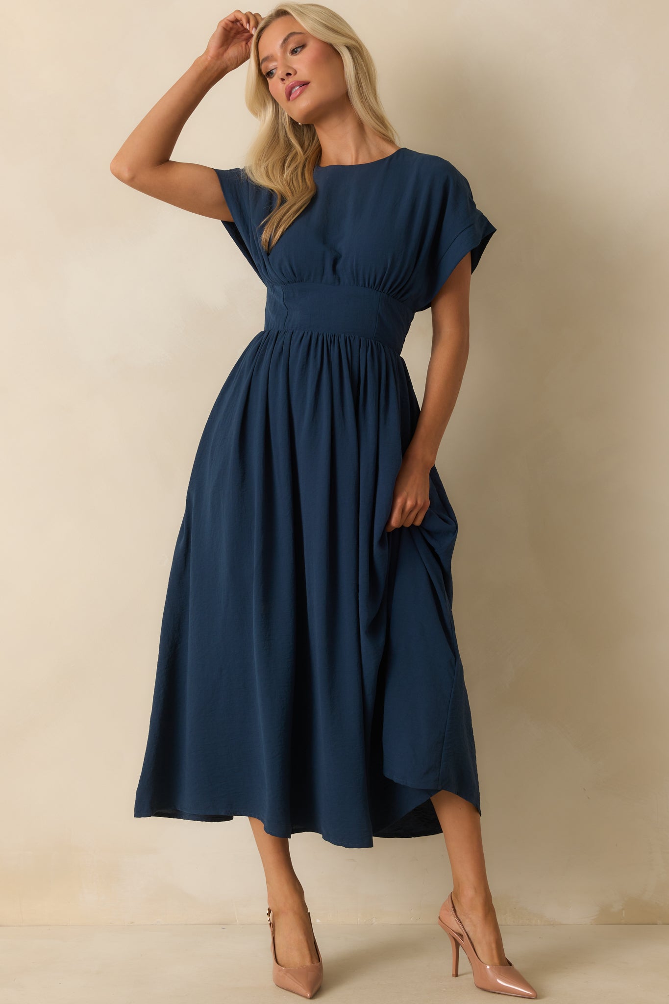 Navy maxi dress with a round neckline and short sleeves.