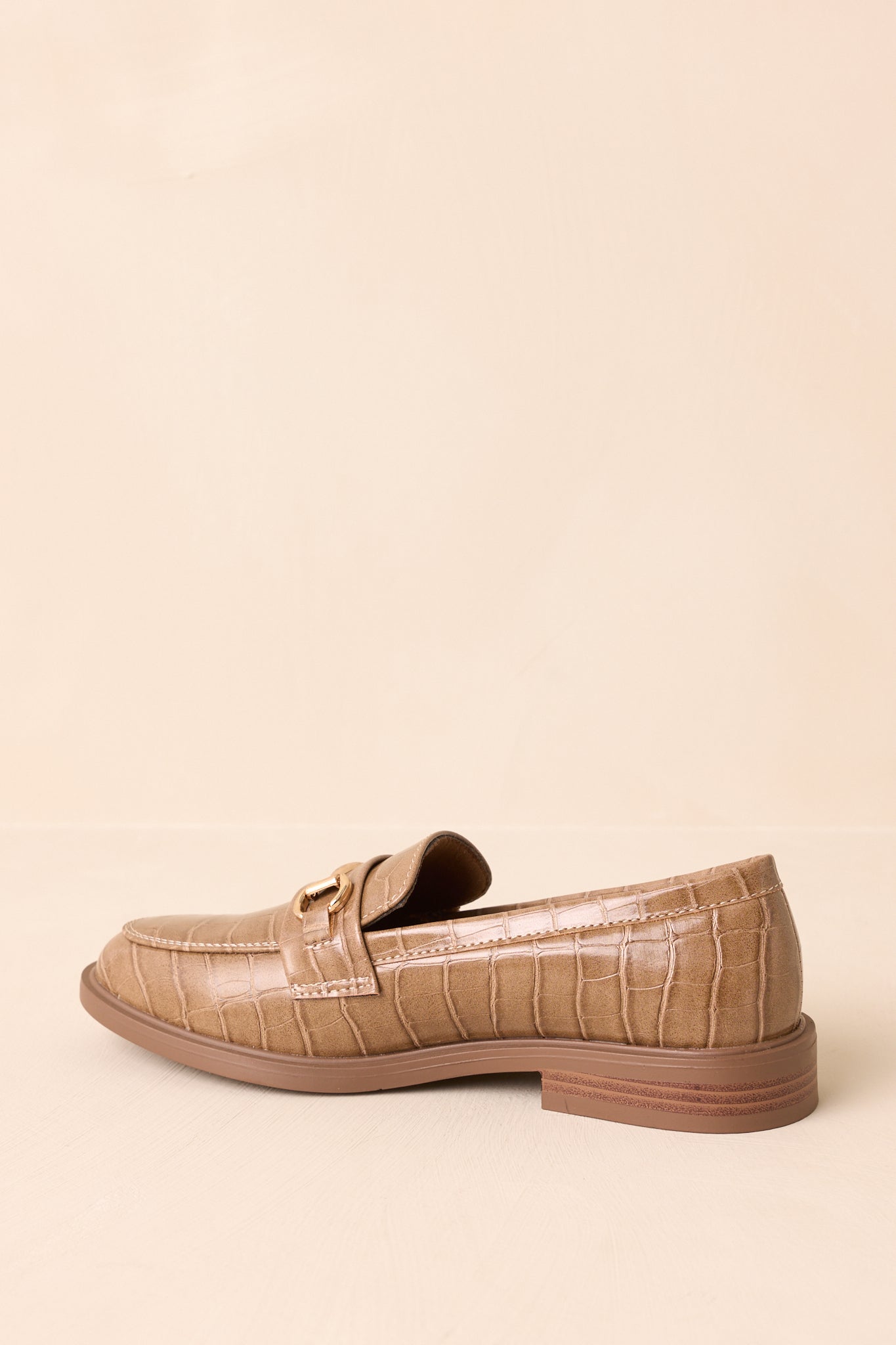 Three-quarter side angle focusing on the slip-on silhouette and heel.