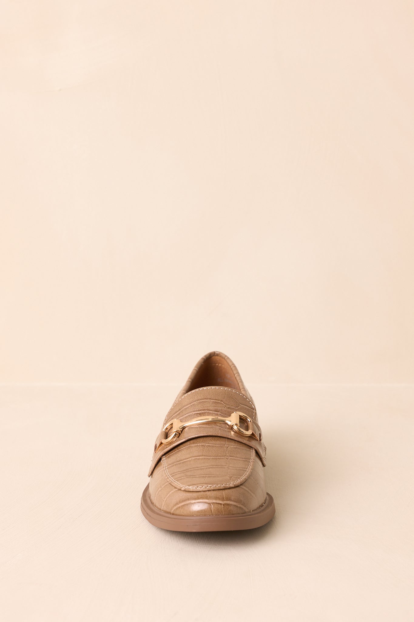 Front angle highlighting the structured almond toe and horsebit detail.