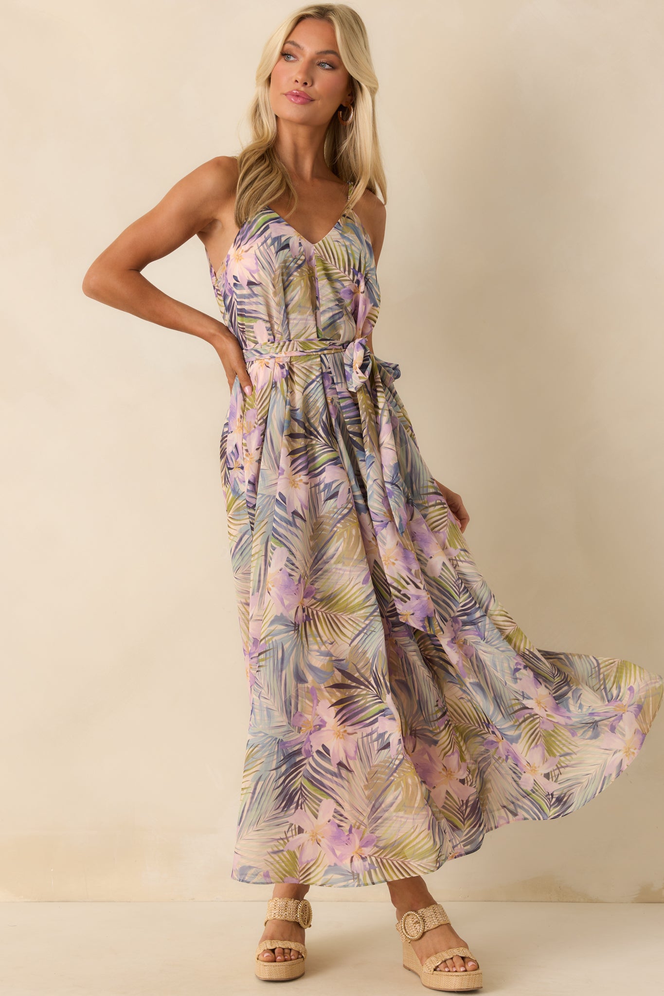 A full body image emphasizing the airy chiffon fabric, relaxed drape, and flattering deep v-neck of the printed maxi dress.