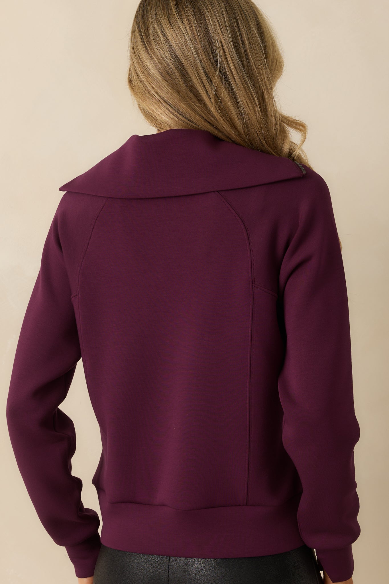 Back view of the plum berry pullover with smooth fabric and oversized fit.