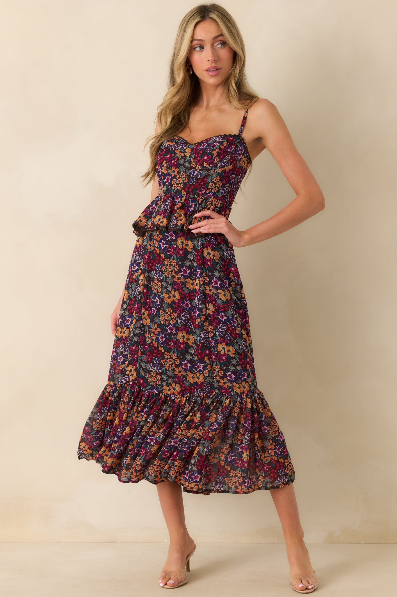 Plum purple maxi dress shown from the front, featuring ruffle band at waist, tiered skirt, and brown lace trim details.