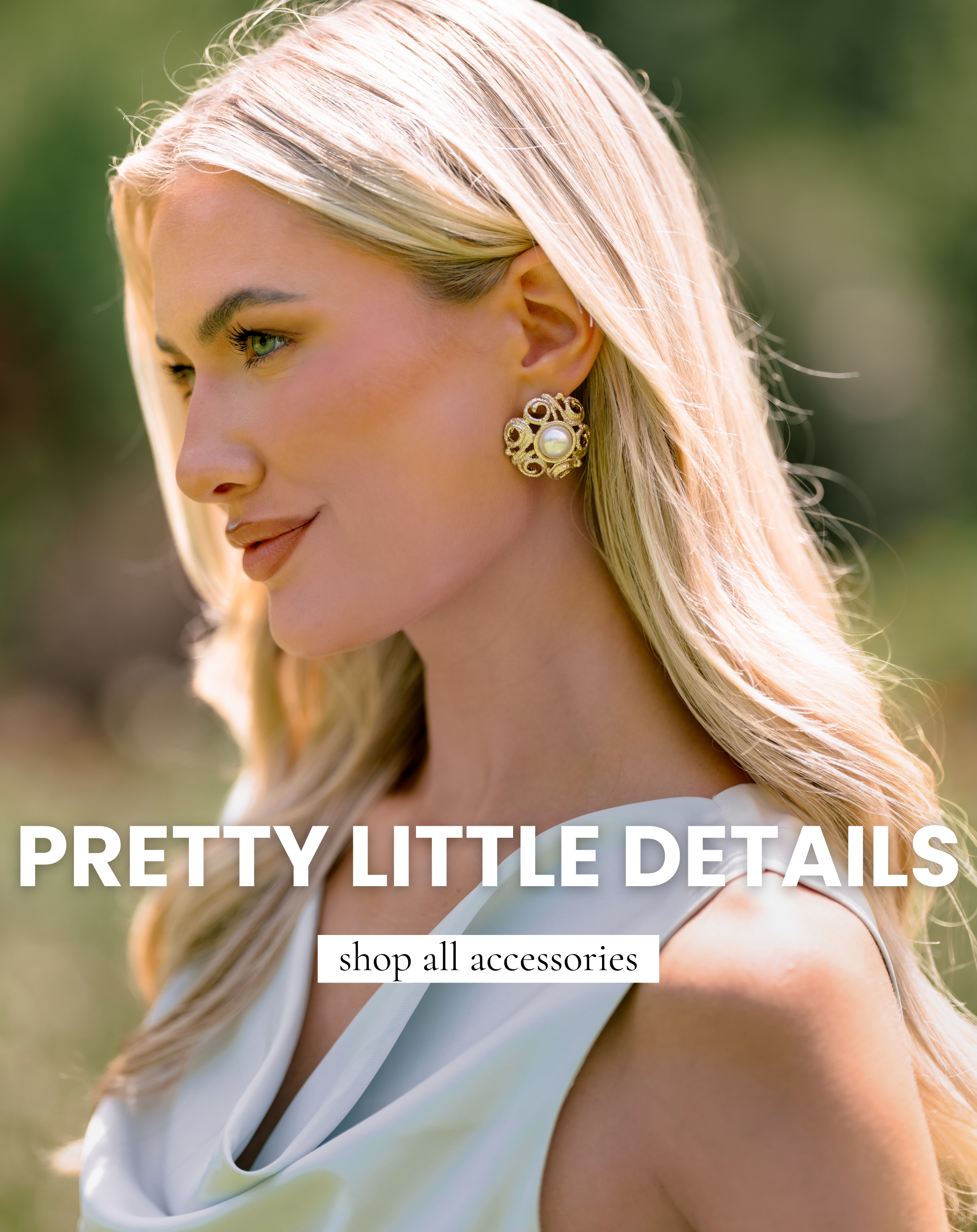 Close-up of a model wearing ornate gold and pearl statement earrings with text promoting the shop all accessories collection.