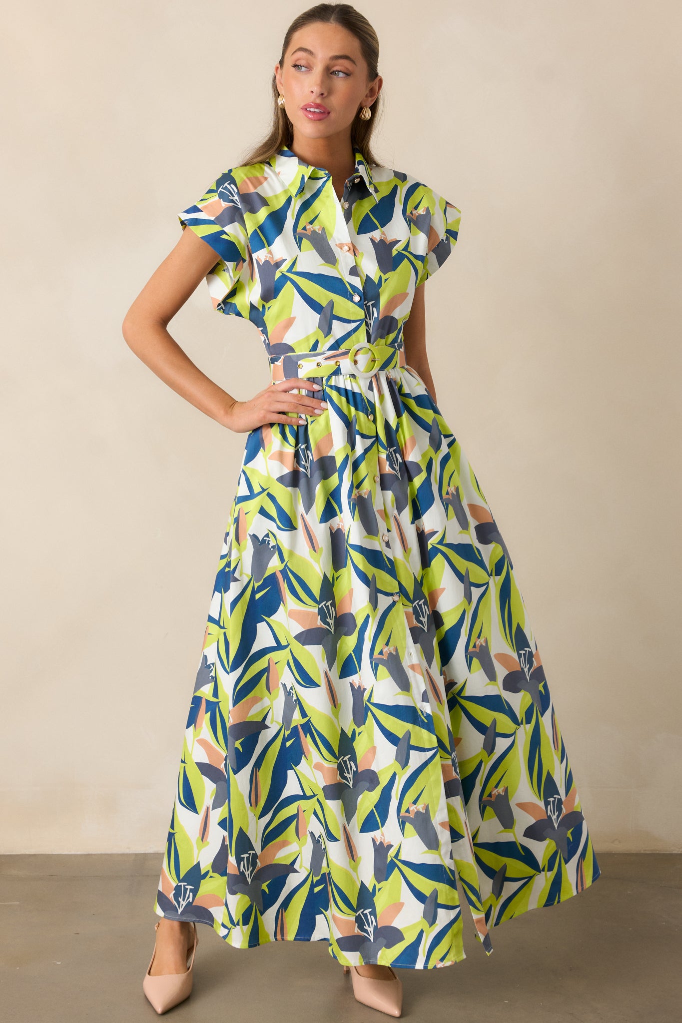 Full front-facing view of maxi dress highlighting functional button front, floral print, and relaxed fit.