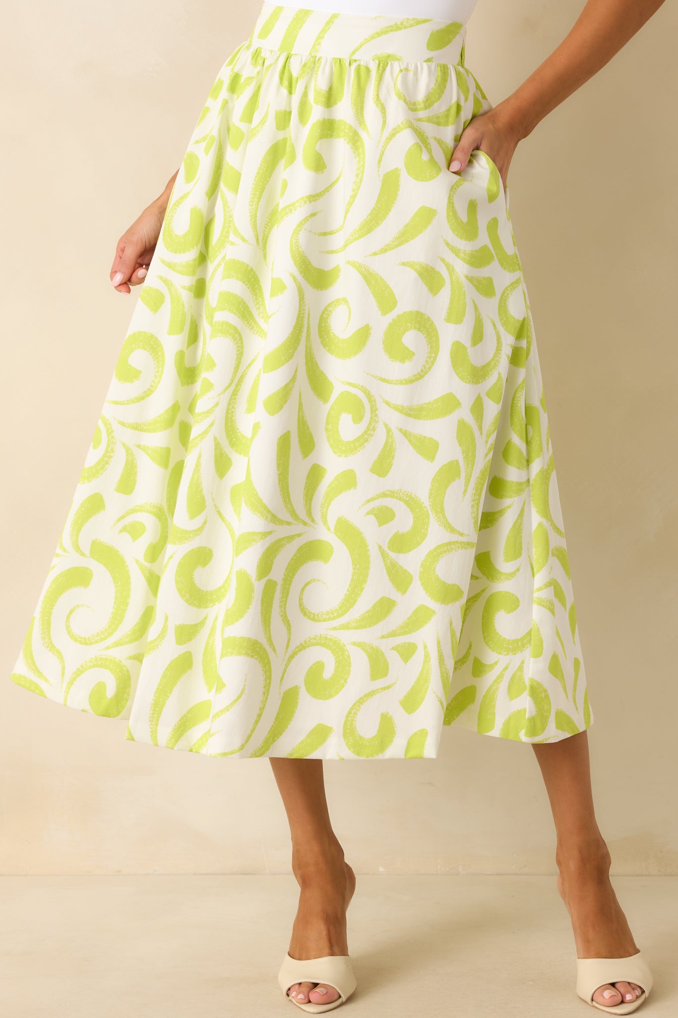 Skirt detail showing the full white lining beneath the airy patterned fabric.