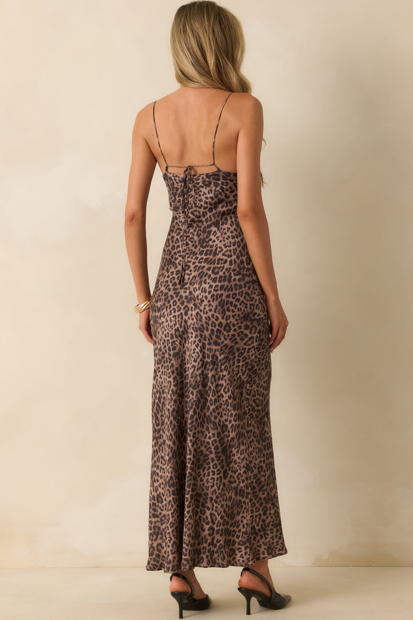 Rear view of the leopard print midi dress showing adjustable straps and full lining.