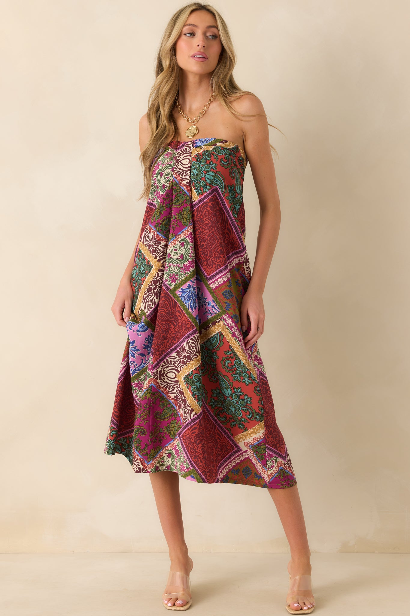 Midi dress in red patchwork print with a box pleat front and smooth flowy fabric.