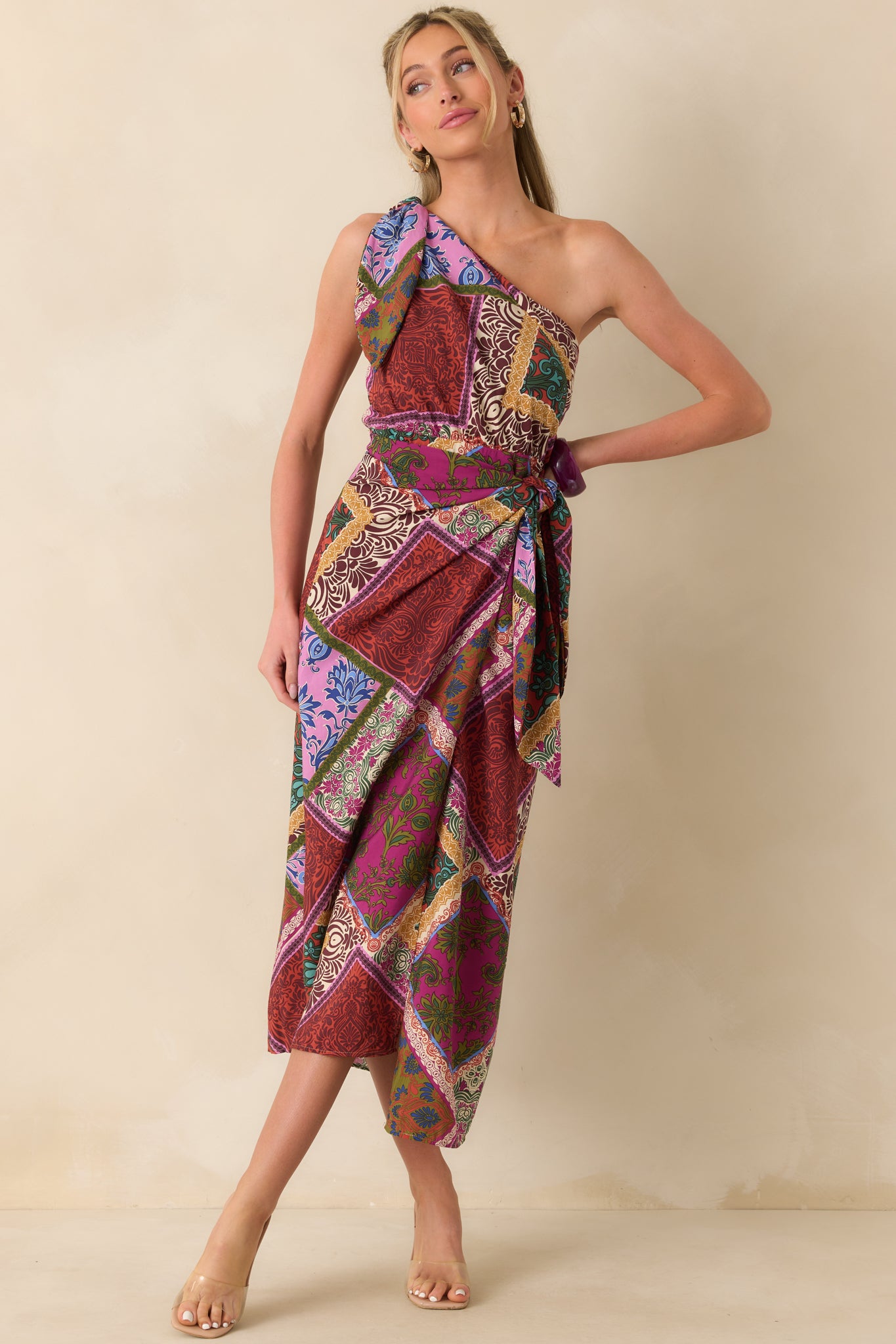 Red multicolor maxi dress shown from the front, featuring smocked back panel and flowing skirt.