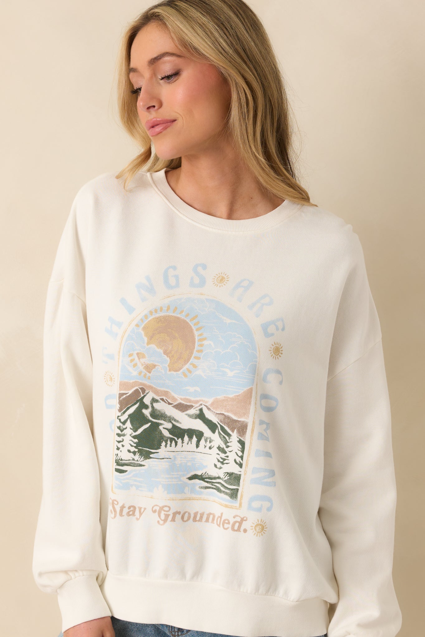 Relaxed fit sweatshirt highlighting oversized silhouette and front graphic design.