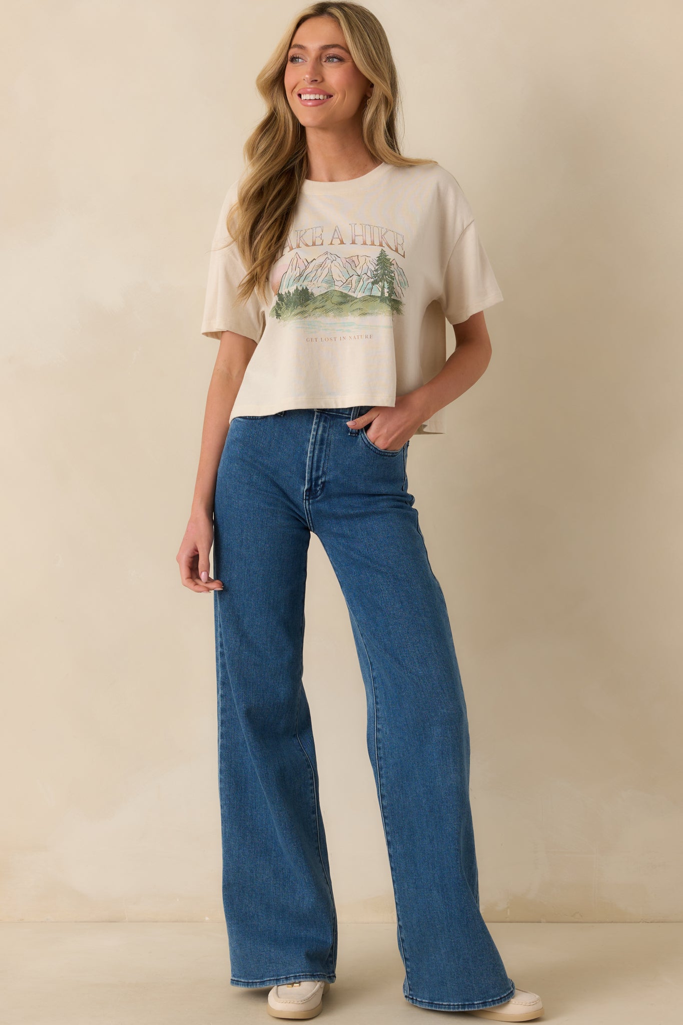 Relaxed graphic tee with short sleeves and “Take A Hike” lettering across front.