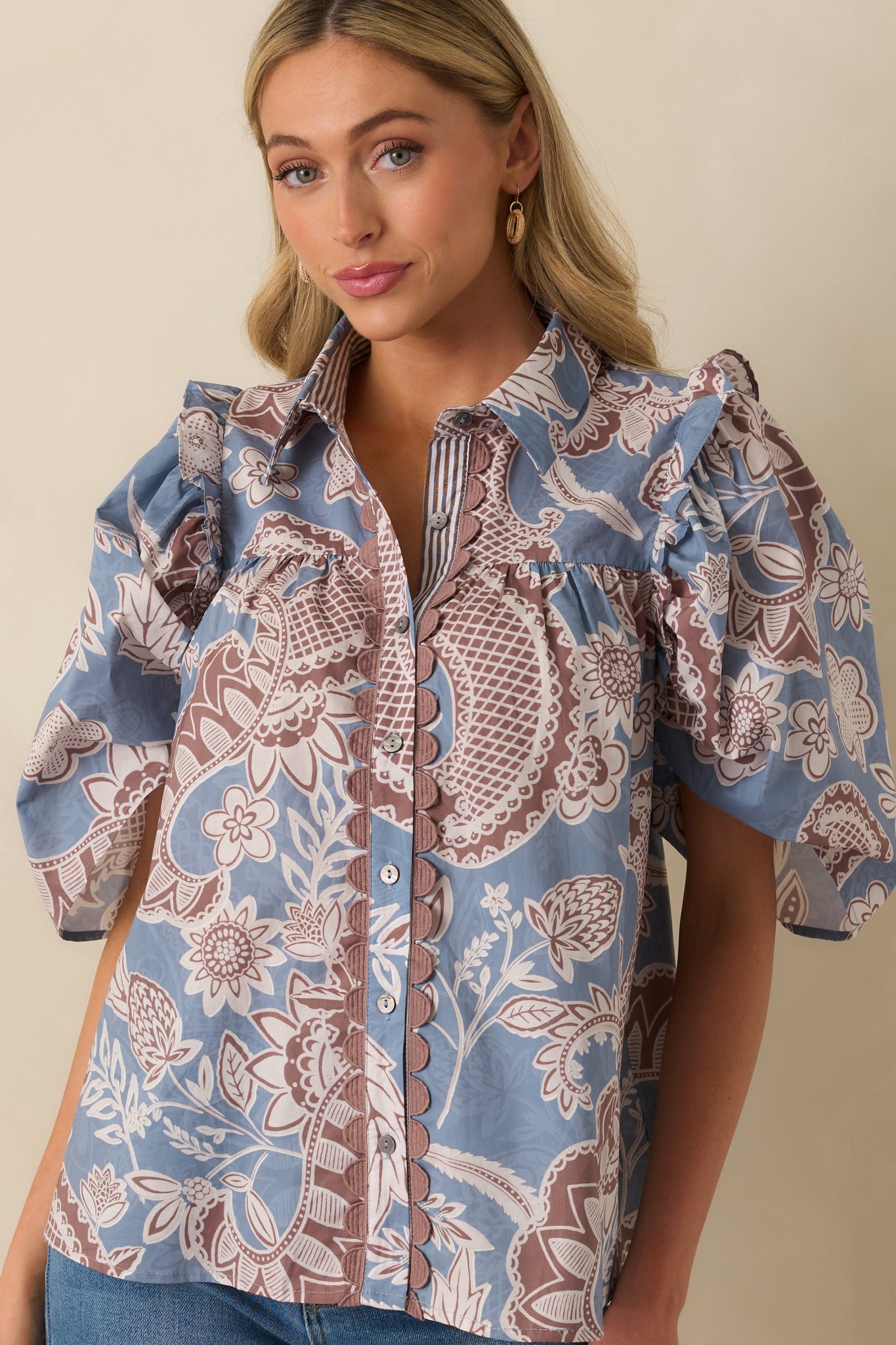 Relaxed silhouette of paisley print blouse with soft cotton texture visible.