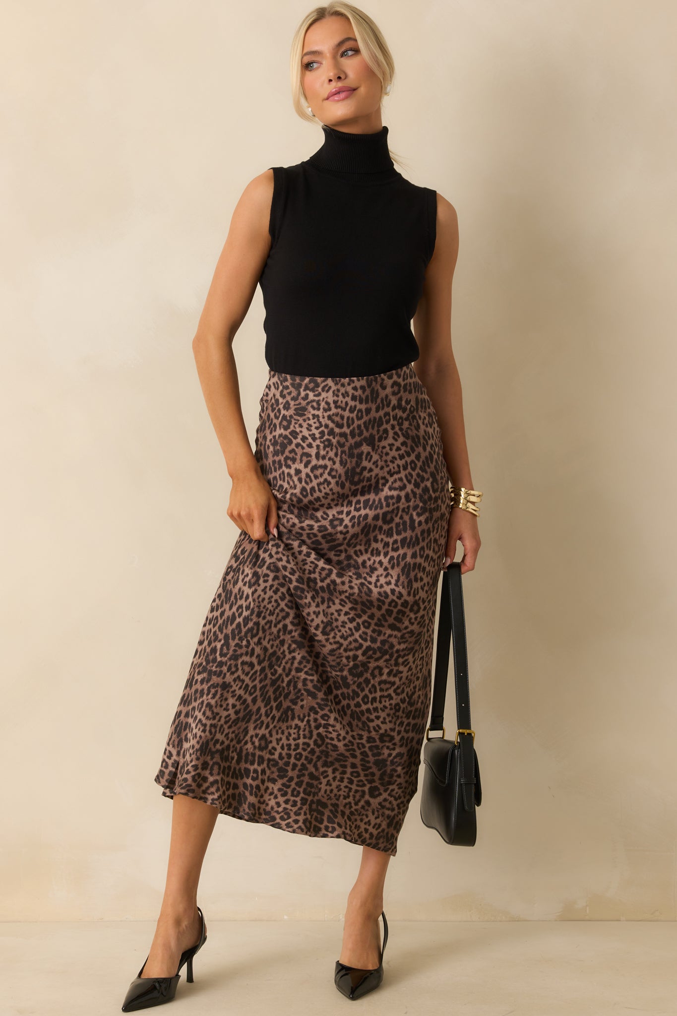 A posed full body view highlighting the flow of the satin fabric with a subtle sheen finish.