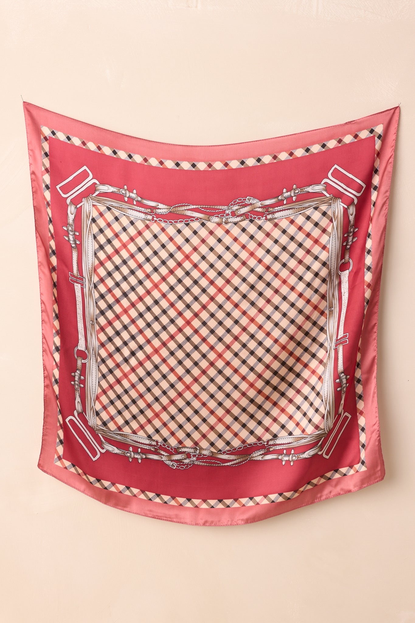 Alternate full display of the scarf with a focus on the contrast between the classic plaid pattern and the ornate chain-and-buckle motifs along the edges.