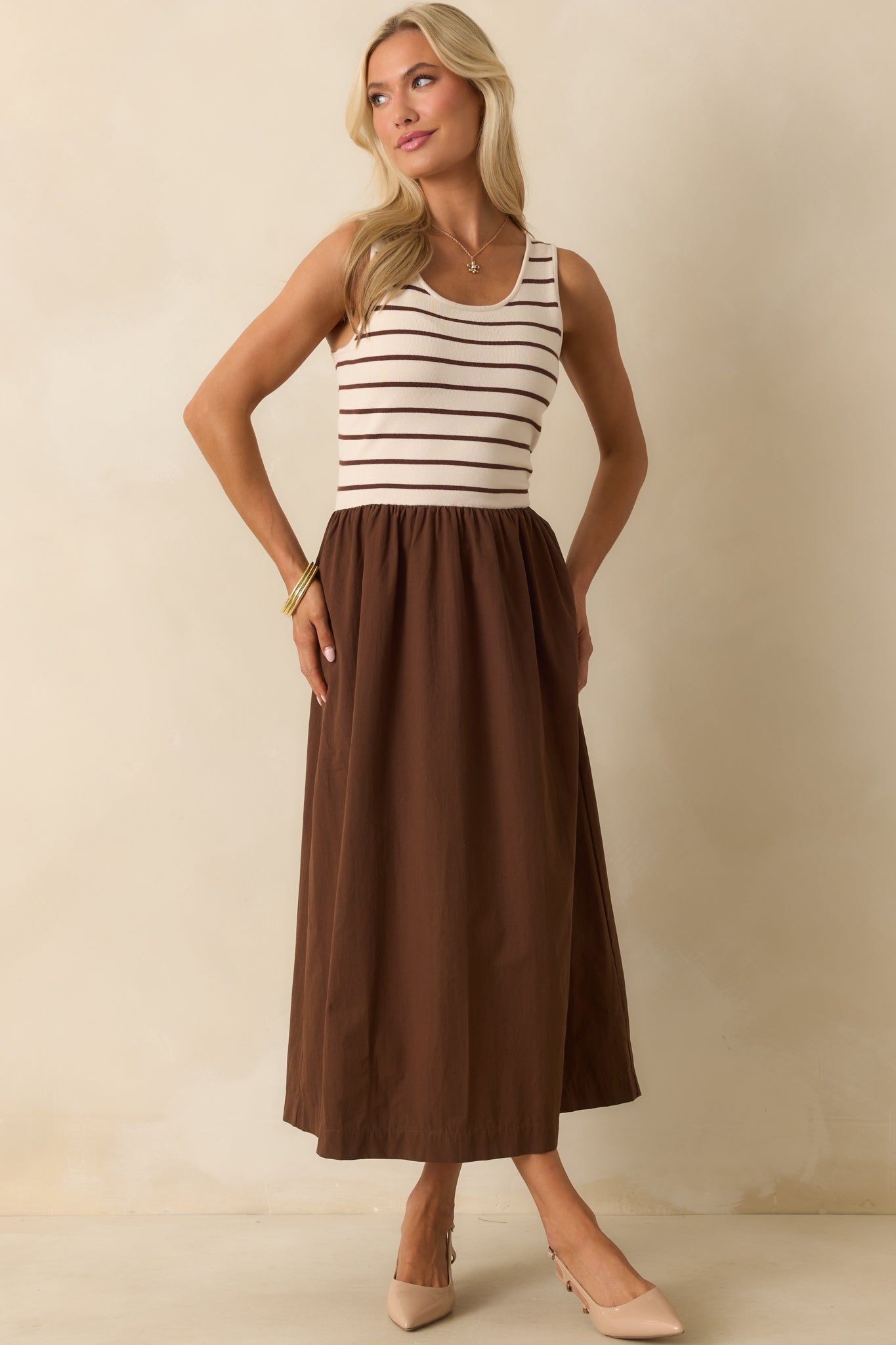 Scoop neckline and classic two-tone design highlight the casual elegance of the maxi dress.