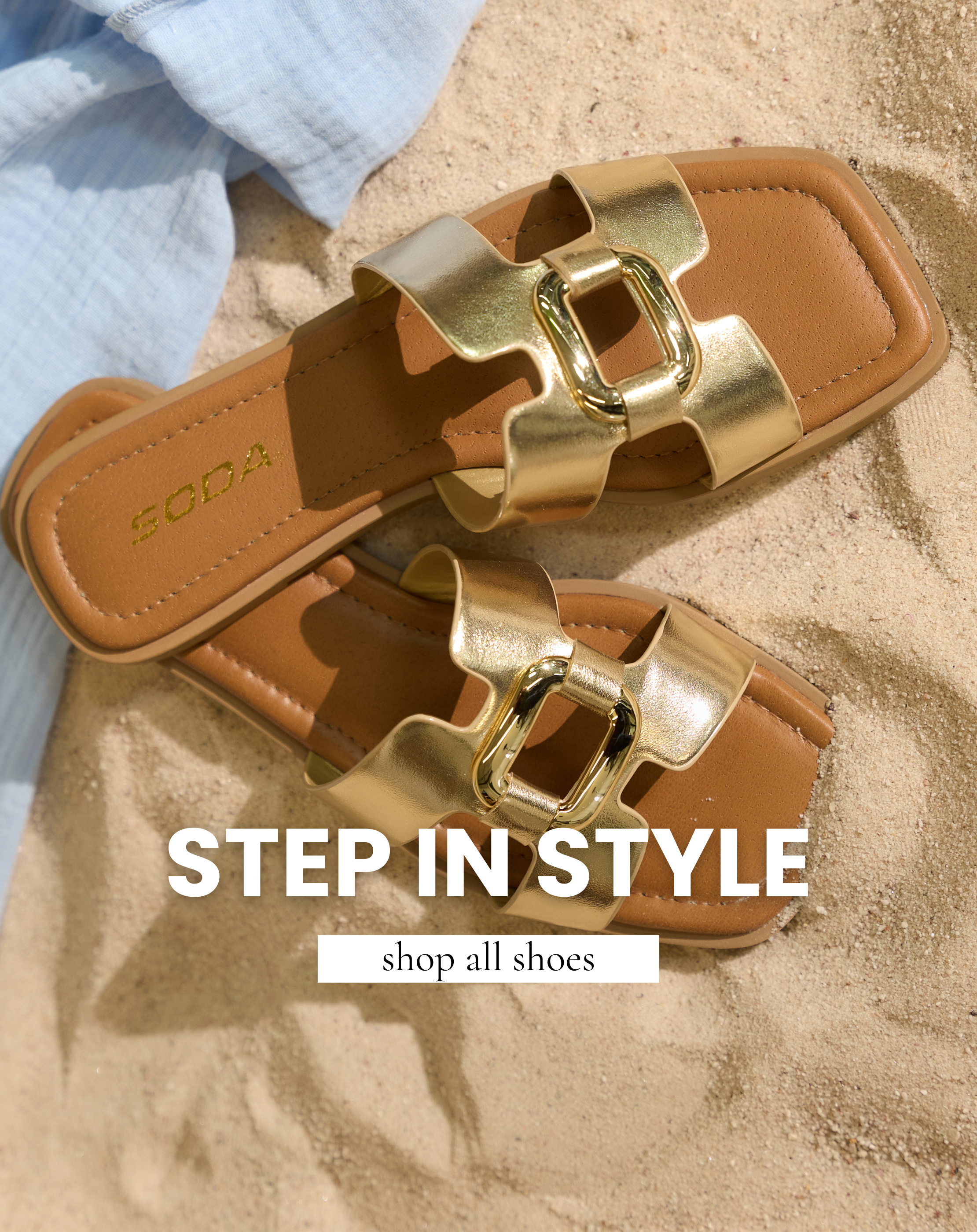 Gold buckle slide sandals on sand and featured in All Shoe Shop.