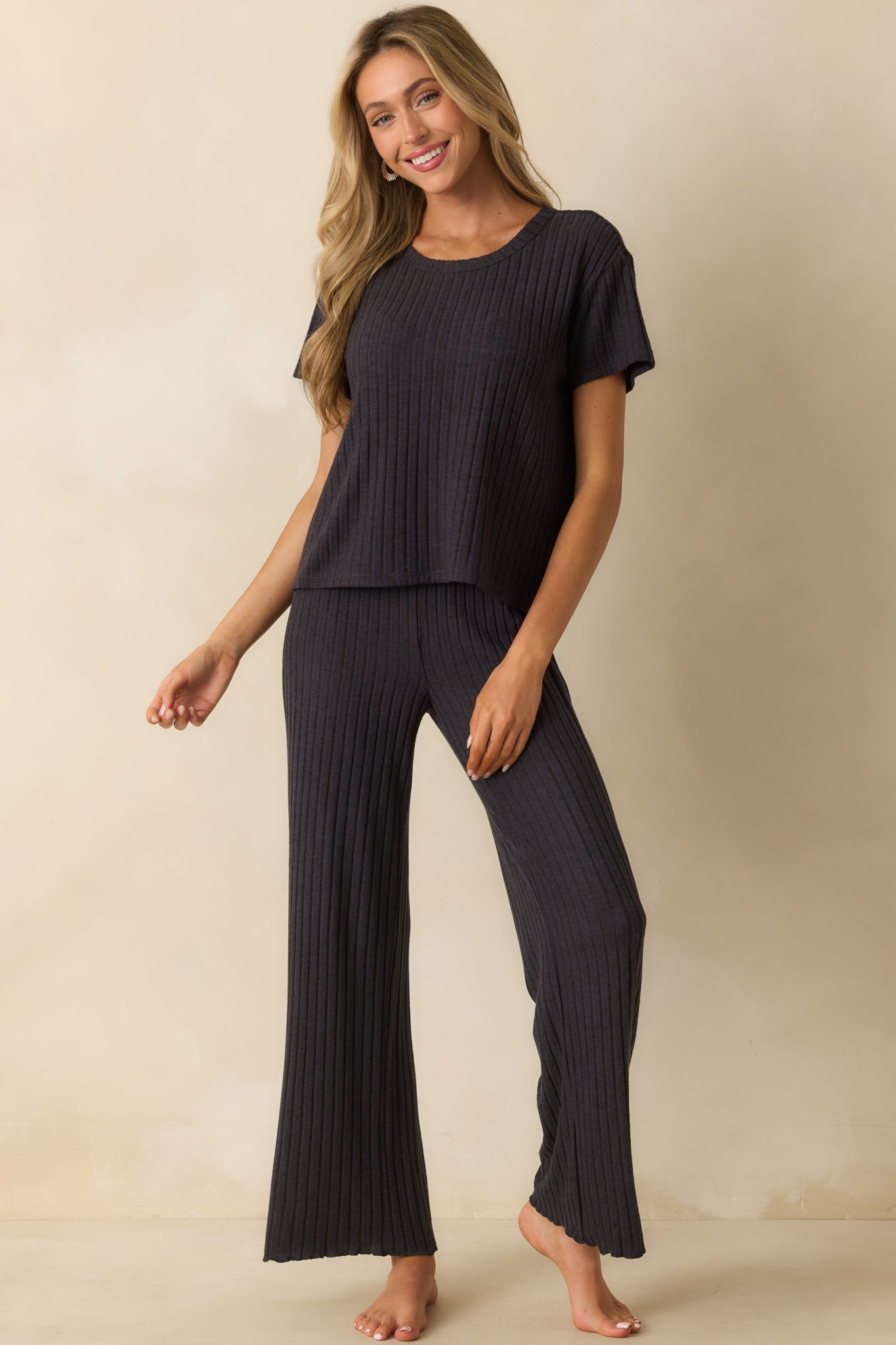 Silky ribbed black tee featuring a roomy silhouette and lightweight feel.