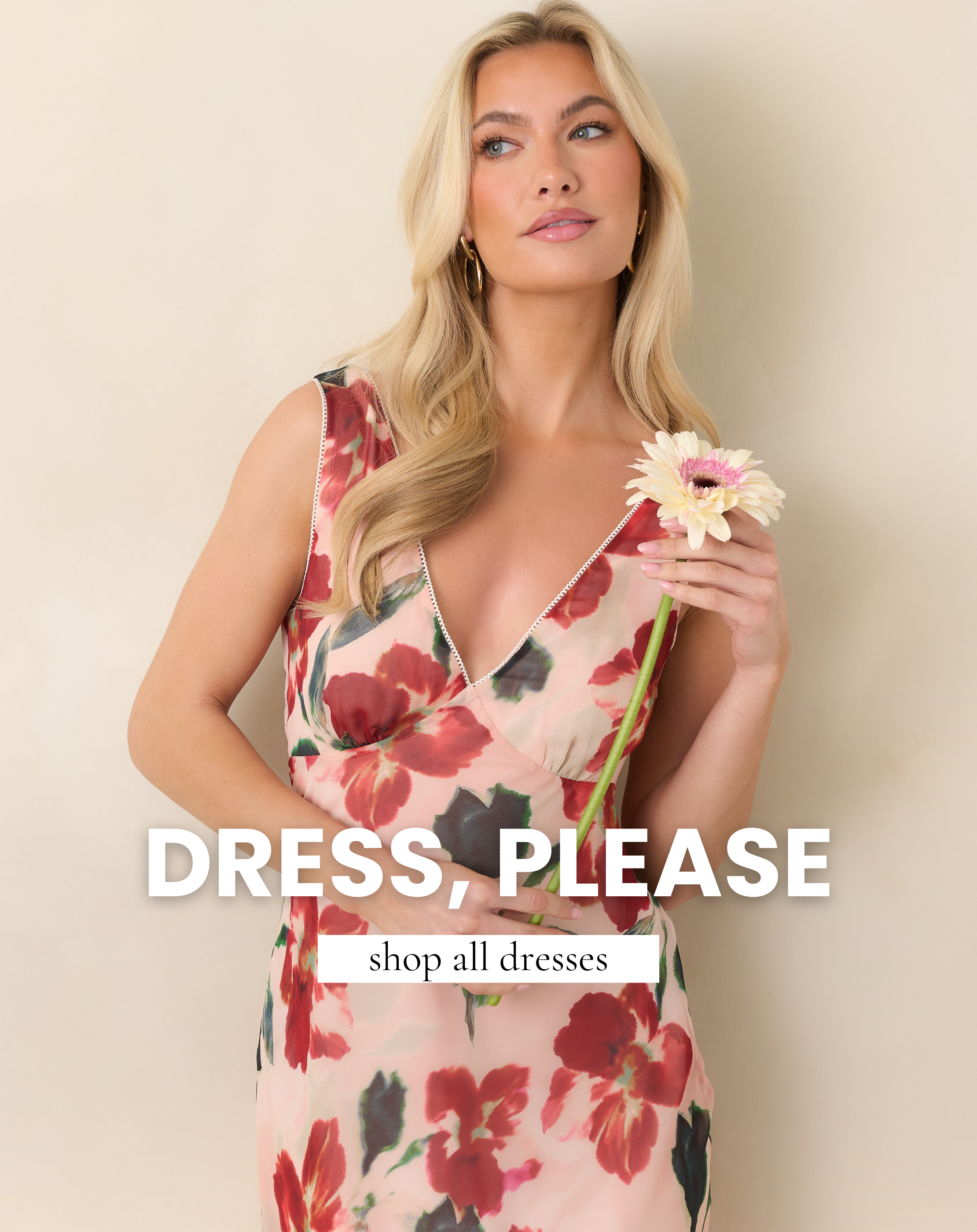 Model wearing a timeless red floral midi dress with a feminine silhouette and classic V neckline, styled for an elegant spring look from our Color Cure collection. Shop all dresses.